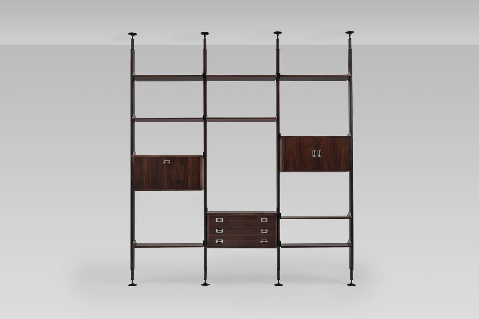 Stunning shelving system by Stildomus, Italy, 1960s. The system is composed of several shelves and three cabinets made from the finest rosewood with a spectacular grain, the solid brass hinges and black aluminium details gives it a very