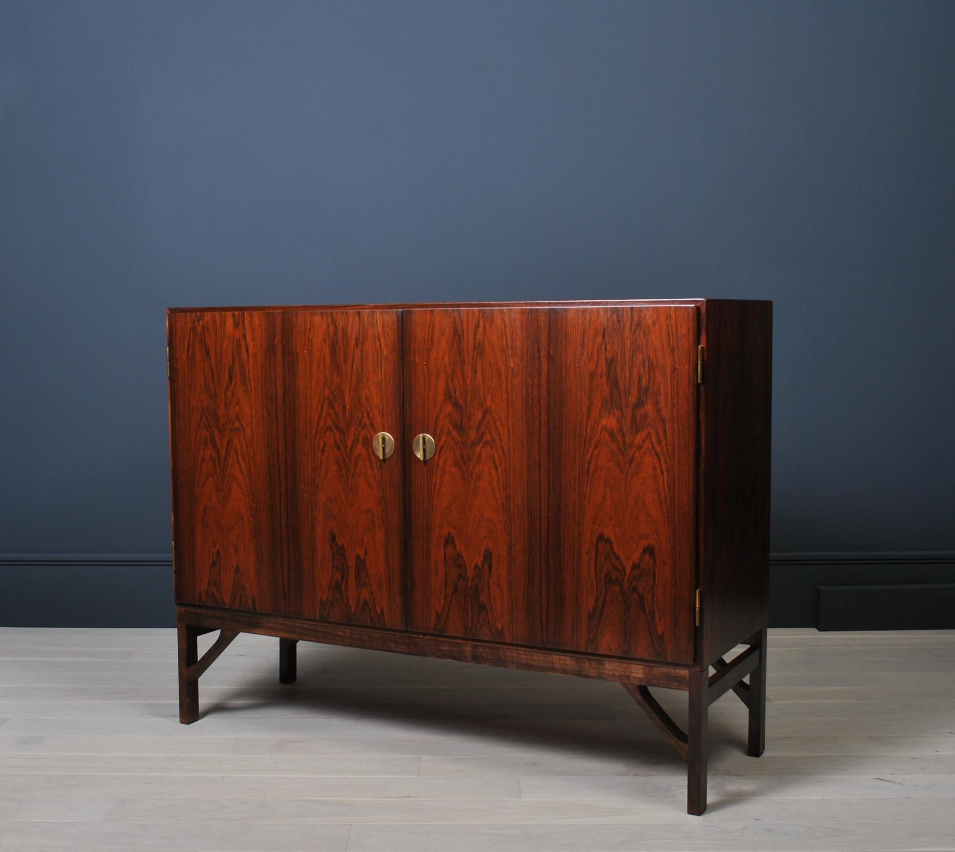 Classic ‘China’ cabinet by Borge Mogensen for C.M Madsen, Denmark circa 1960. Rosewood with maple interior shelves, sliding drawers and brass keys/fittings.