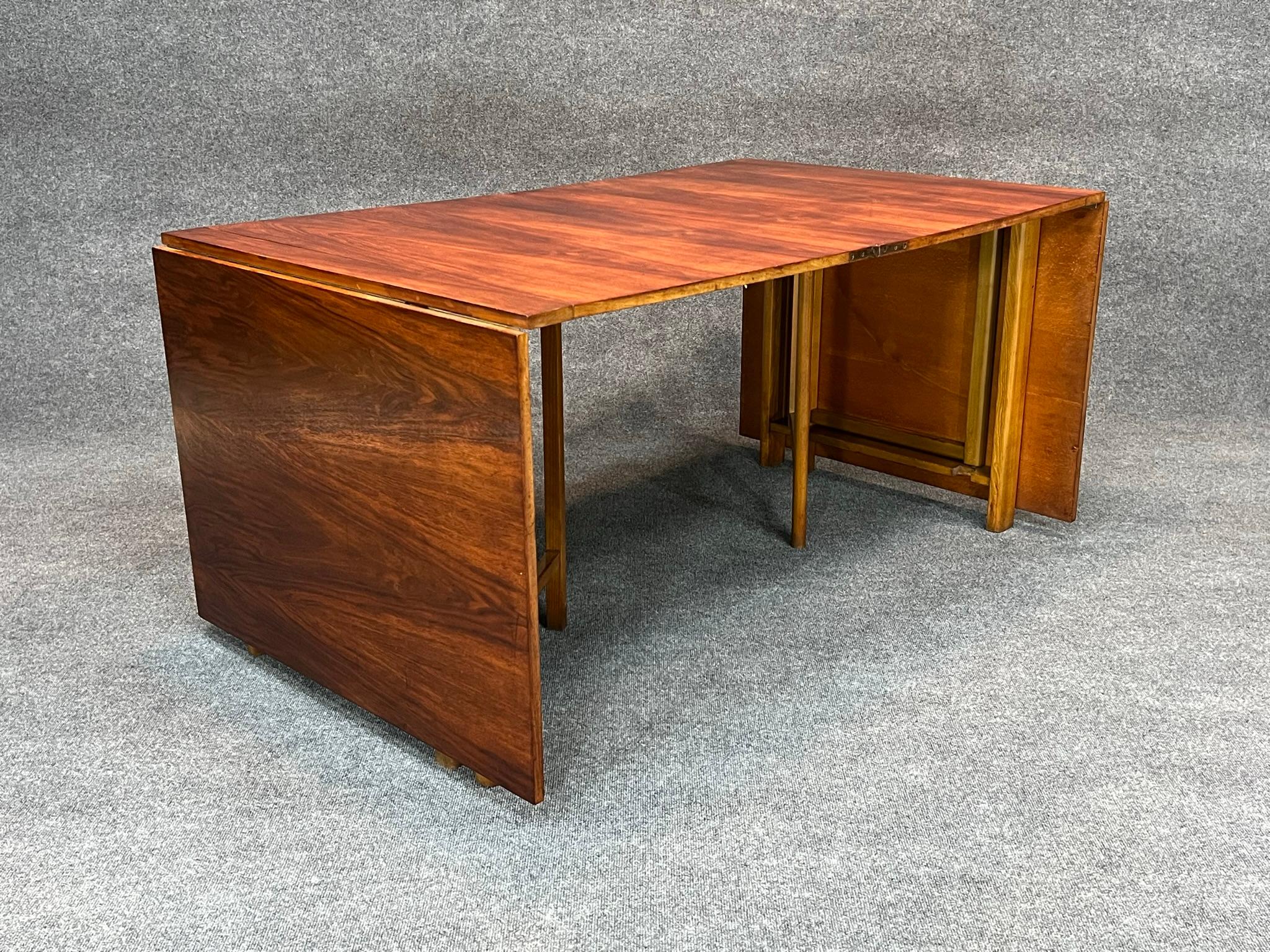 Rosewood Bruno Mathsson Maria folding dining table, Sweden, c. 1936

Rare Mid-Century Modern Bruno Mathsson Maria folding table crated in rosewood and made in Sweden. Amazing cleaver and versatile design that can be configured in numerous