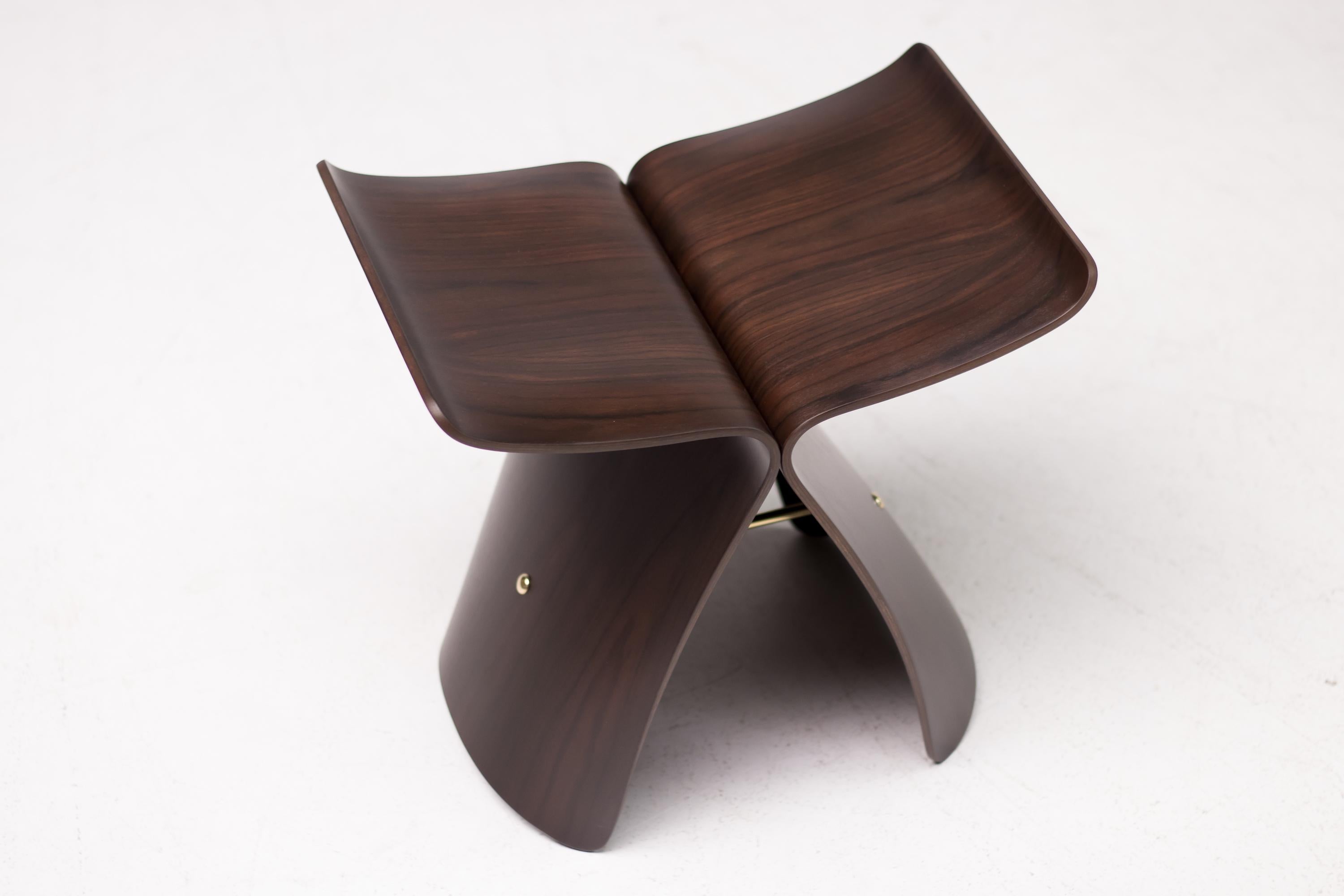 A perfect fusion of western function and eastern or Asian sensibility, the iconic butterfly stool was originally conceived in 1954 by Japanese designer Sori Yanagi. The stool is made from two curving and inverted L-shaped rosewood sections, each