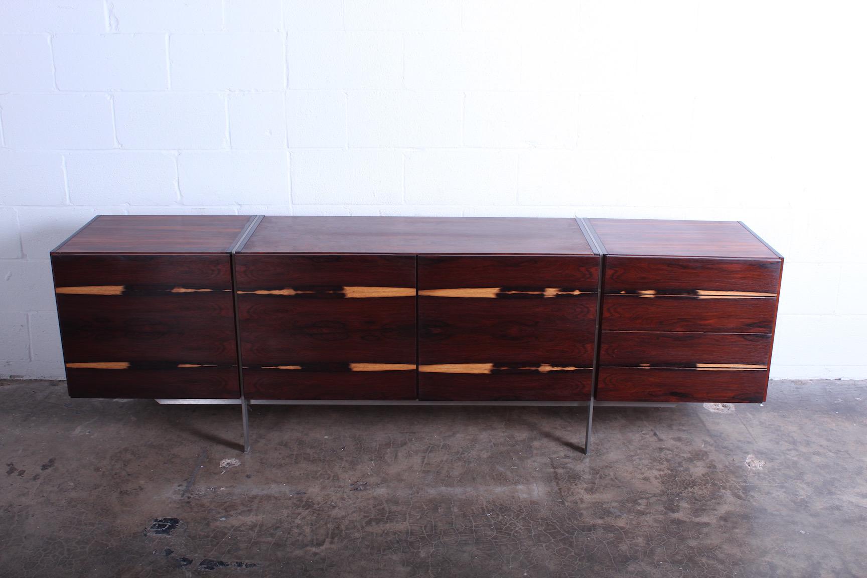 A rare rosewood cabinet with expressive sap grain and brushed steel frame. 