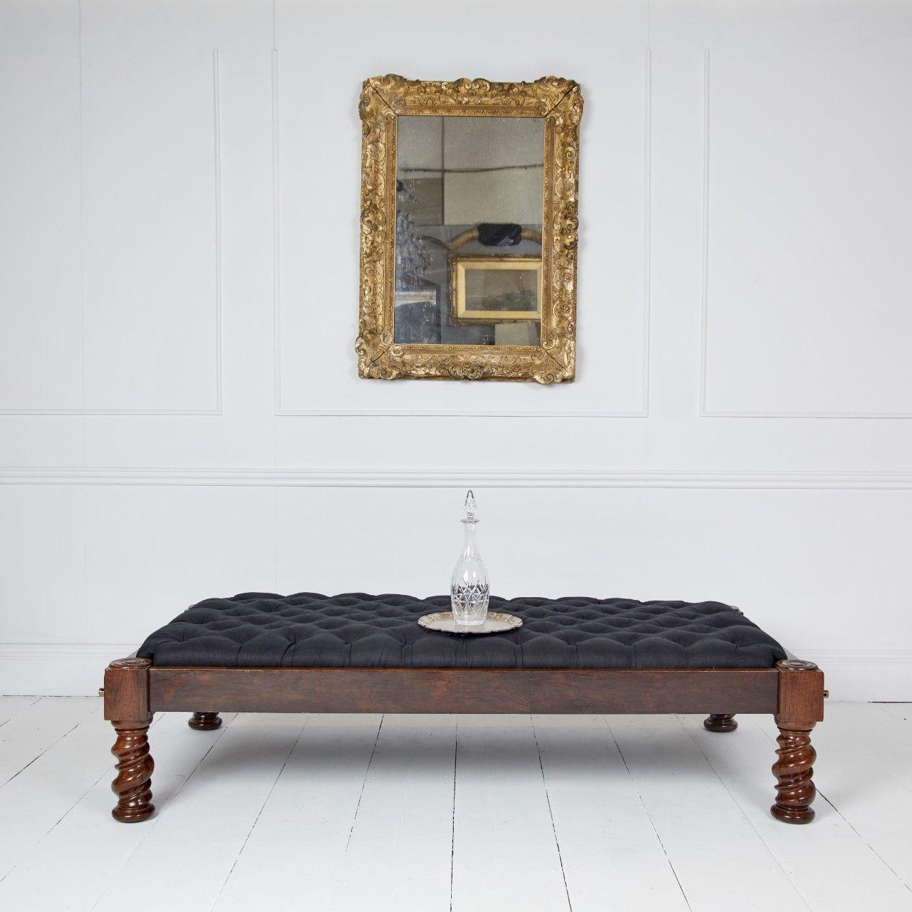 Unusual campaign dissembling stool standing on substantial turned Walnut legs.
Secured with hand made brass and steel screws.
Covered in crisp black linen with black tufts.

19th Century

H: 41cm (16in) W: 165cm (65in) D: 91cm (36in)

Ref MS089

