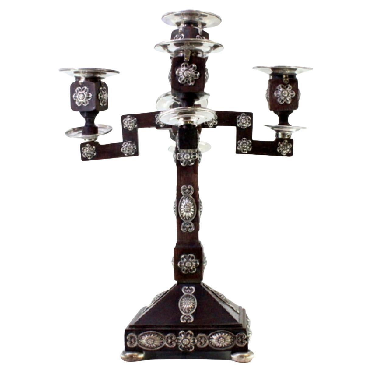 Rosewood candelabra with silver applications and four arms on square bases