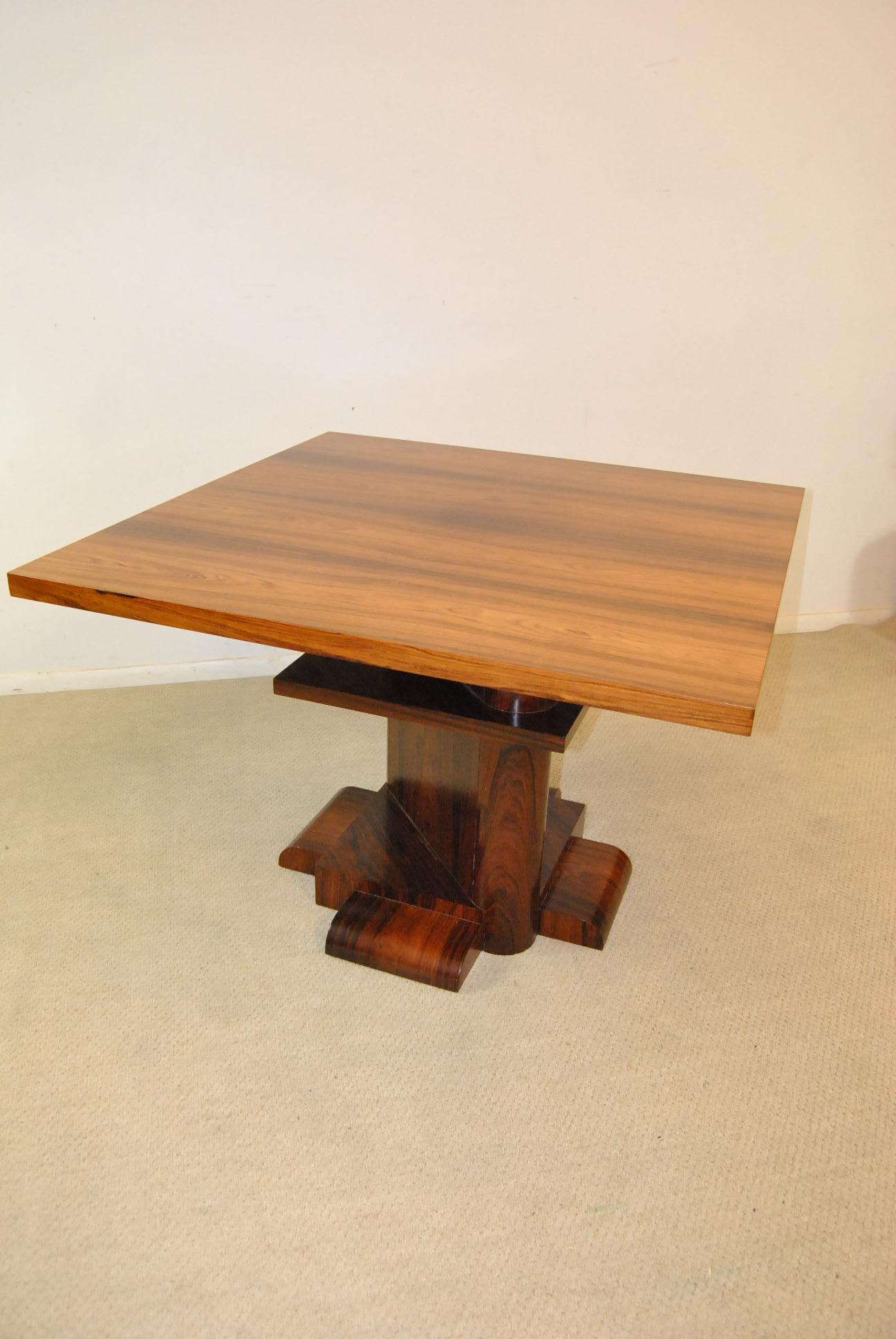 This exquisite rosewood centre table/ dining table/library table designed by Larry Lazlo for Bexley Heath for Widdicomb was in a very limited edition of only 100 tables ever done. It is modern with exquisite rare rosewood.. The two metal tags are on