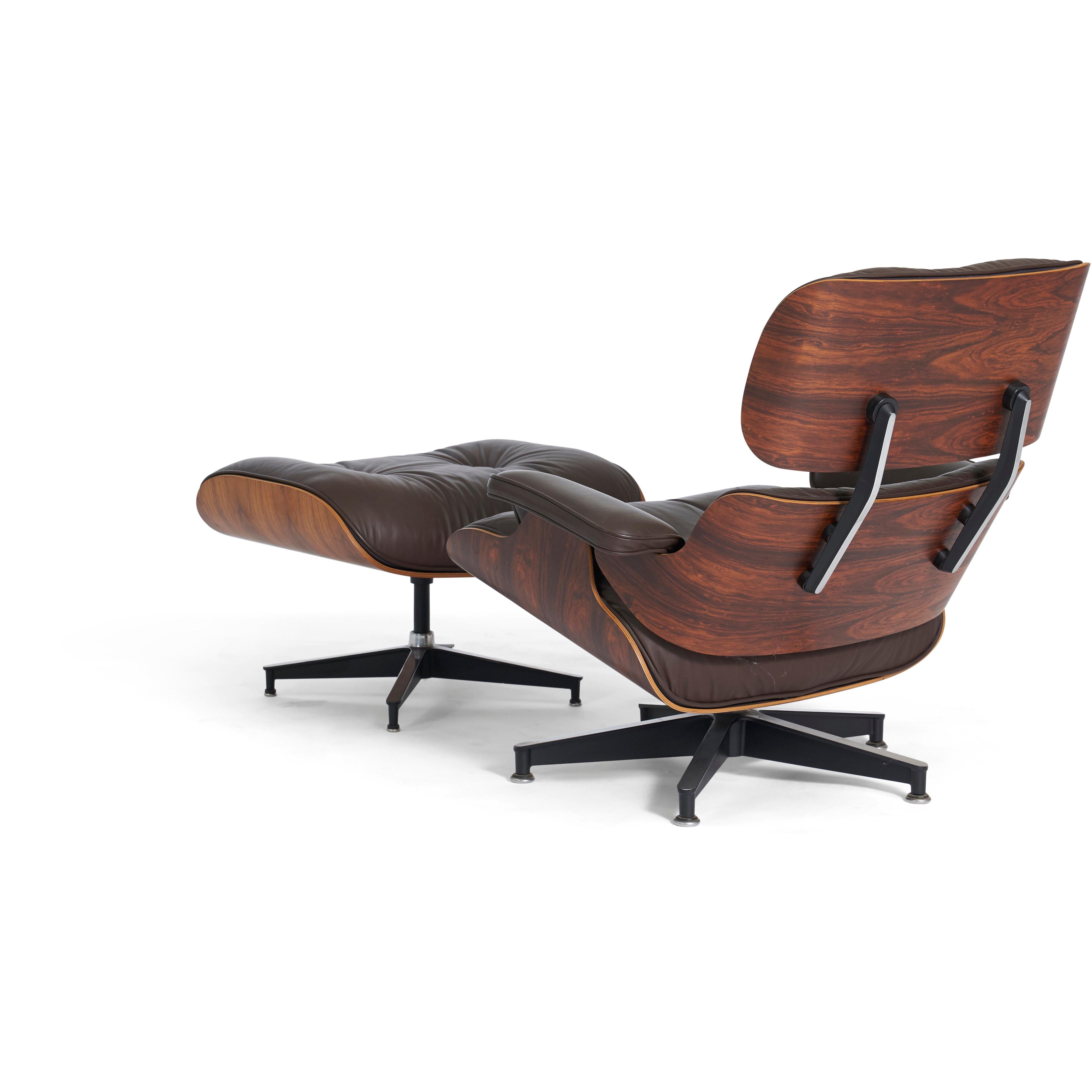 Rosewood lounge chair and ottoman designed by Charles and Ray Eames for Herman Miller in the 1950s. This particular set date to 1970s productions Original dark brown leather with all original rosewood shells.