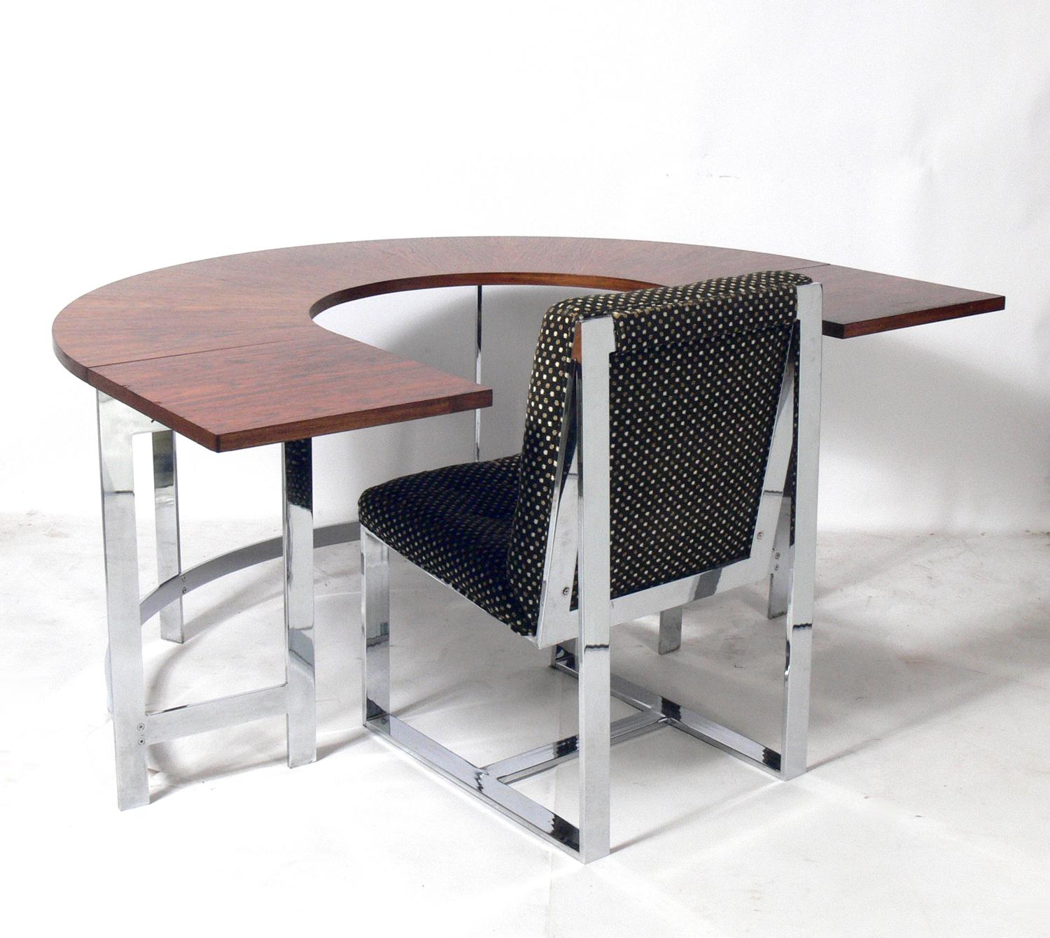 Rosewood and chrome arc desk and chair, circa 1960s. Very heavy and well made. The chair is currently being reupholstered and can be completed in your fabric at no additional charge. Simply send us 2 yards of your fabric after purchase. With the