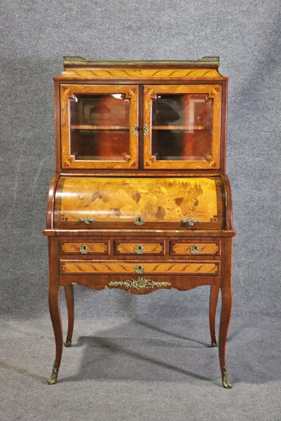 From Slatoff Estate. Rosewood with exotic veneer. Vitrine top with marble top. Rouge marble gallery. Beveled glass doors. Brass accents and foot caps. 58