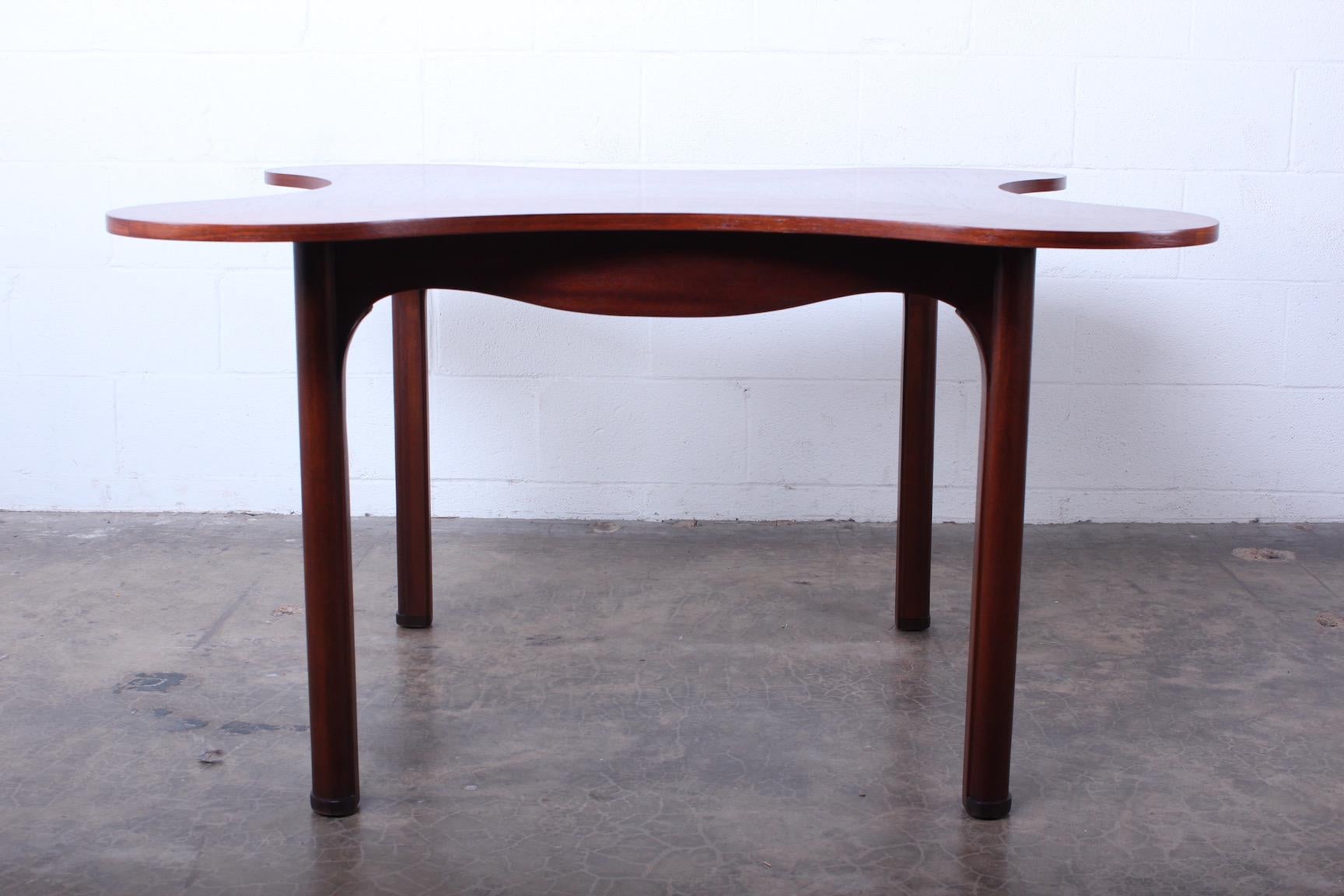 The clover game table in rosewood and mahogany by Edward Wormley for Dunbar.