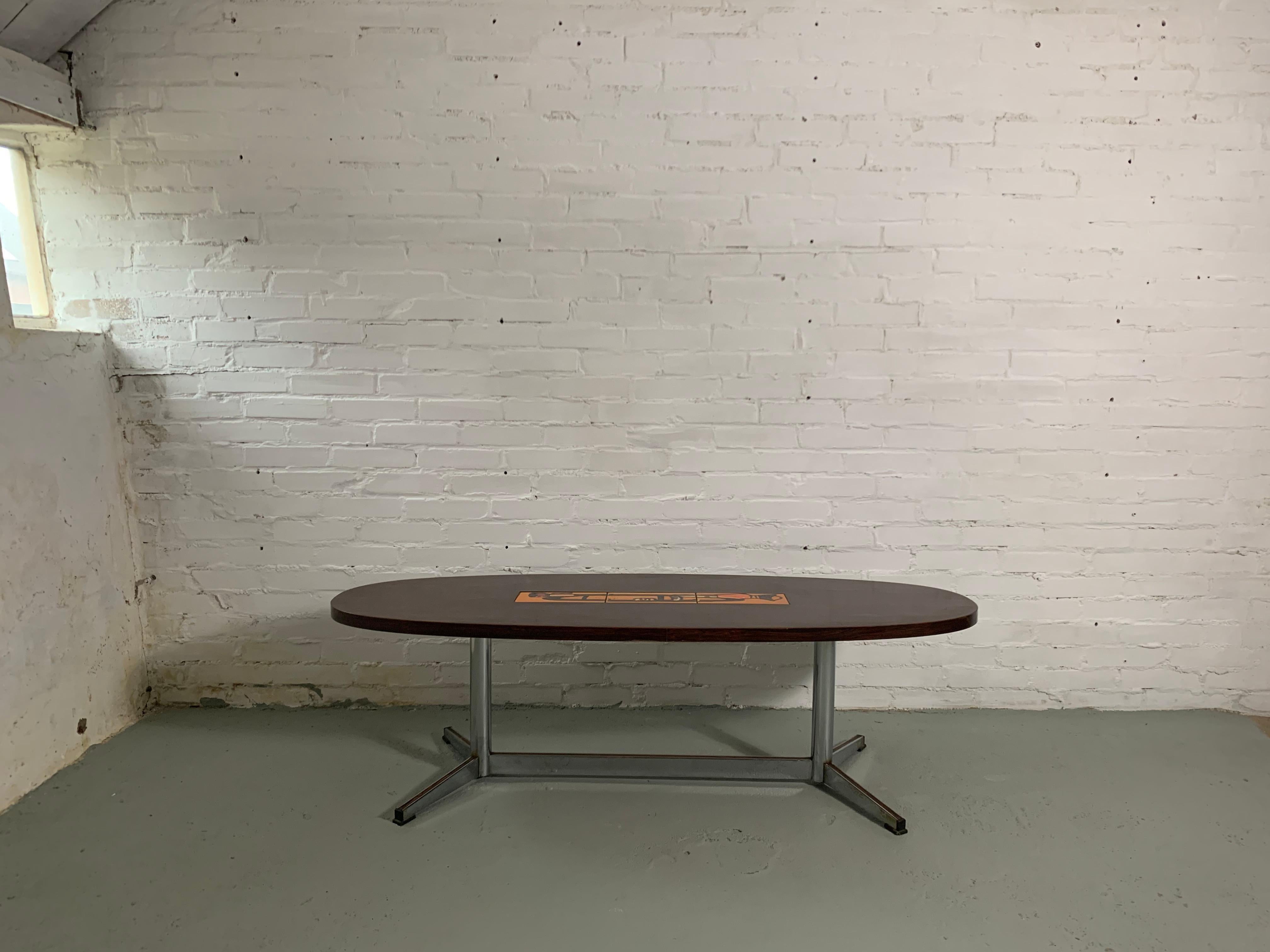 Rosewood cofee table with ceramic in warm orange colours and steel chromed legs. Decorative, stylish, in good vintage condition.
H42.0 x W140.0 x D50.0 cm