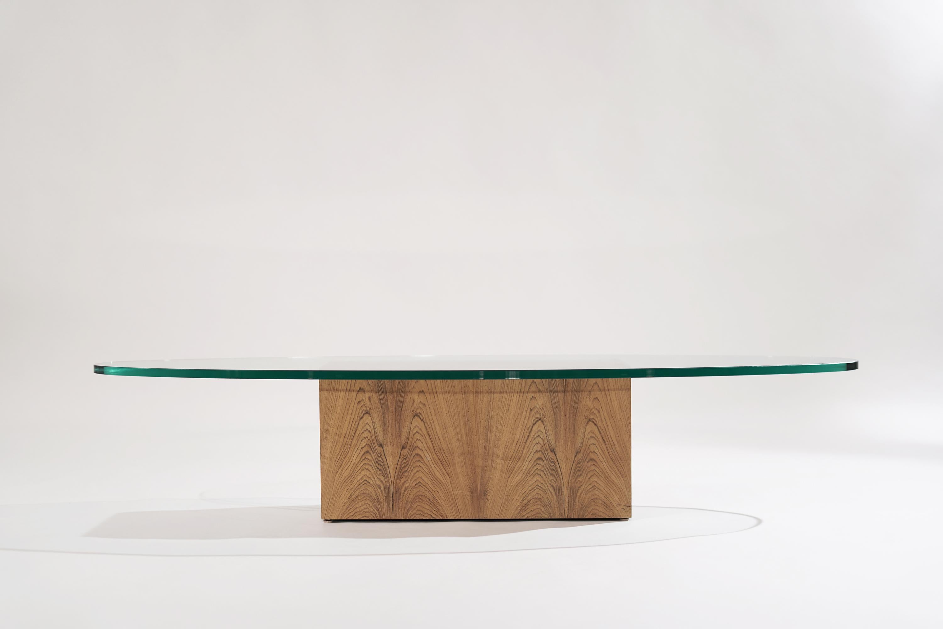 A rare bleached rosewood coffee table designed by Harvey Probber, circa 1950s. Newly one-inch oval glass top. 

Other designers from this era include Paul McCobb, George Nakashima, Tommi Parzinger, Jens Risom, and T.H. Robsjohn-Gibbings.
    
