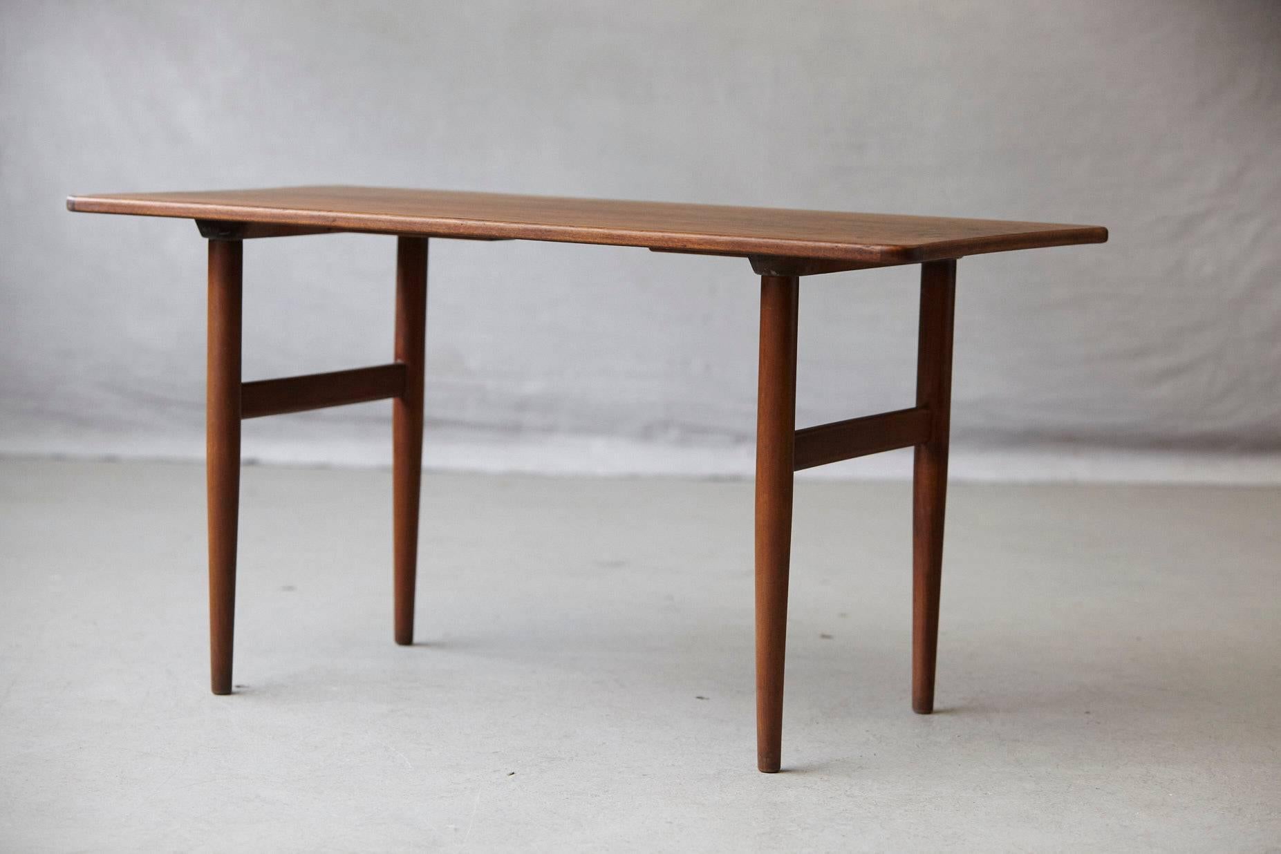 Beautiful rosewood side or small coffee table designed by Kurt Østervig for Jason Møbler Danmark, circa 1960s. 
Stamped on the underside Jason Denmark.
Slightly sculpted top with rounded corners which gives the table a very soft and harmonious