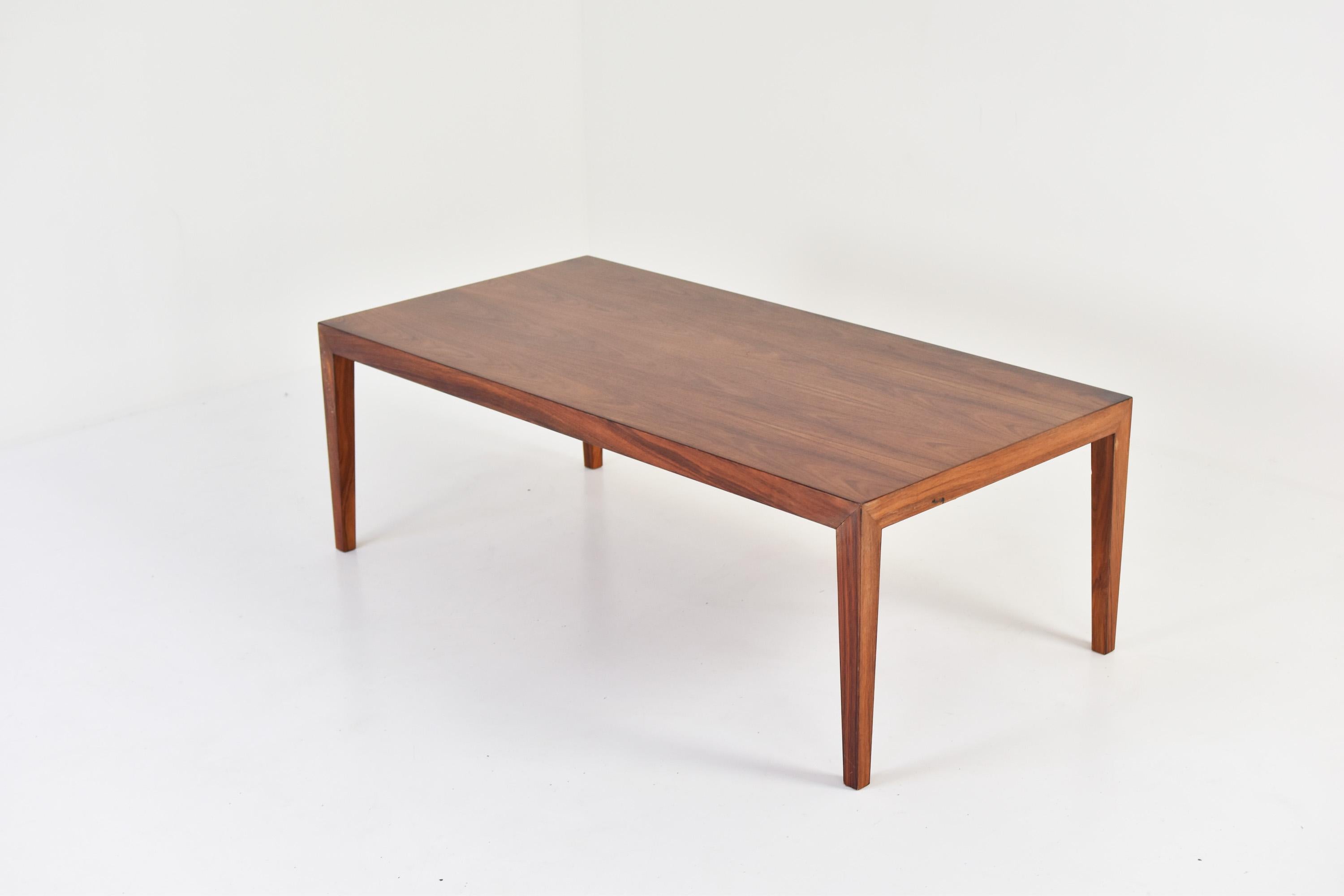 Rosewood coffee table by Severin Hansen for Haslev, Denmark, 1960s. This rectangular coffee table has a superb grain on the rosewood top. Labeled underneath.