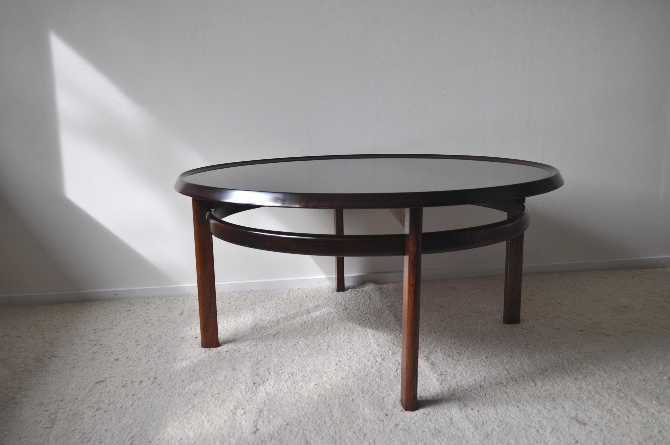 Large round coffee table in rosewood designed by Norwegian designer Torbjørn Afdal. Produced by Haug Snekkeri, Bruksbo.

Torbjørn Afdal (1917-1999) began as a designer at Bruksbo Tegnekontor in 1946. He was one of the most prolific furniture