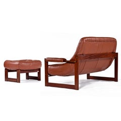 Fauteuil et pouf Earth MP-163 en bois de rose et cuir cognac de Percival Lafer