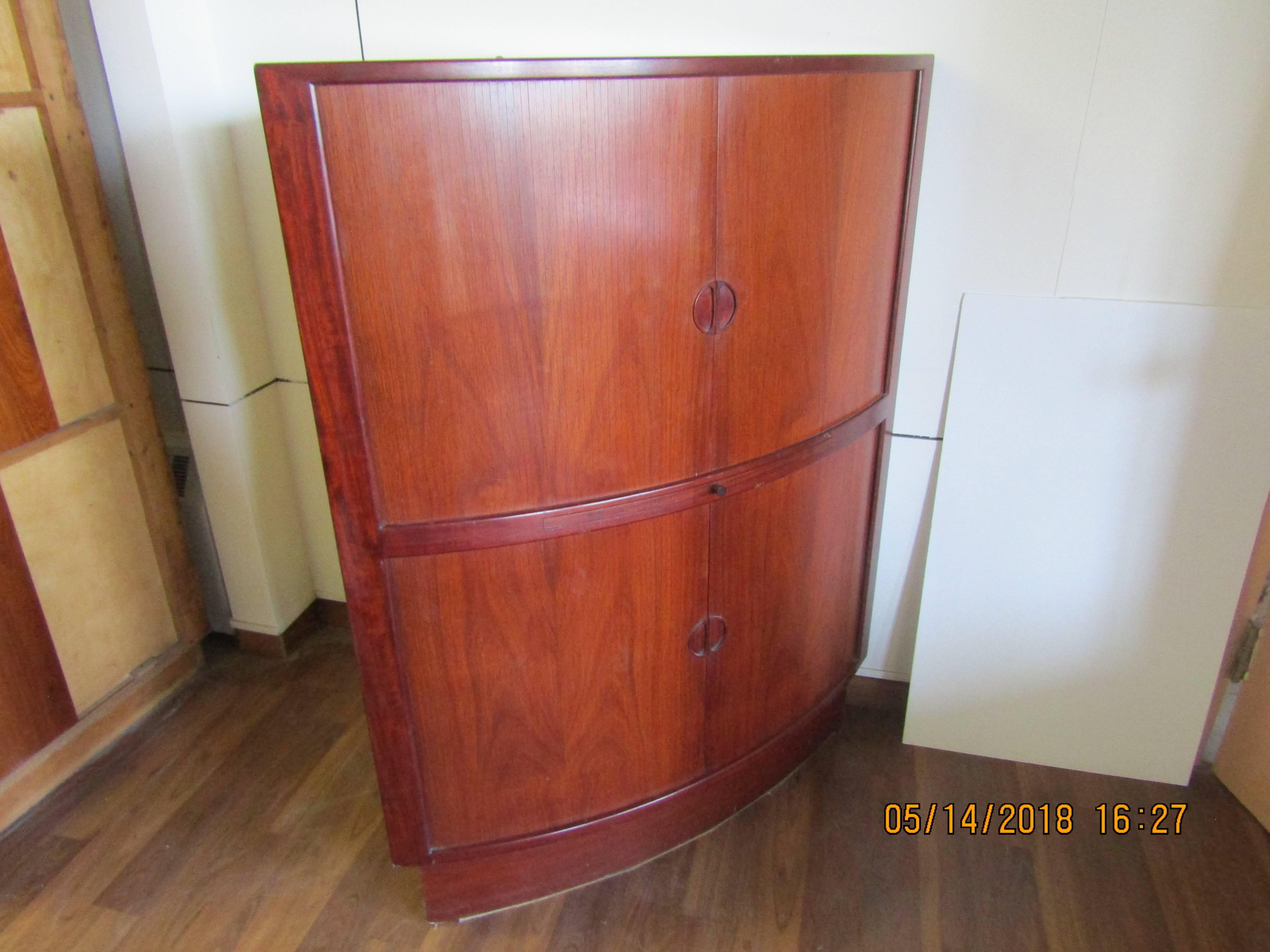 Rosewood corner cabinet with mirrored bar and melamine shelf and tambour doors. Interior lights in bar section.