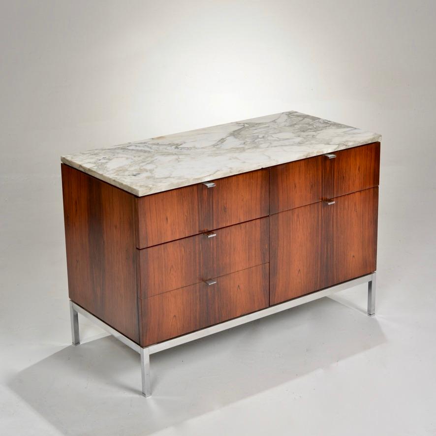 Gorgeous five-drawer rosewood credenza with chrome base and original calacatta marble top, designed by Florence Knoll for Knoll International. The cabinet has been refinished and in excellent condition.  The marble top has moderate wear.  




 