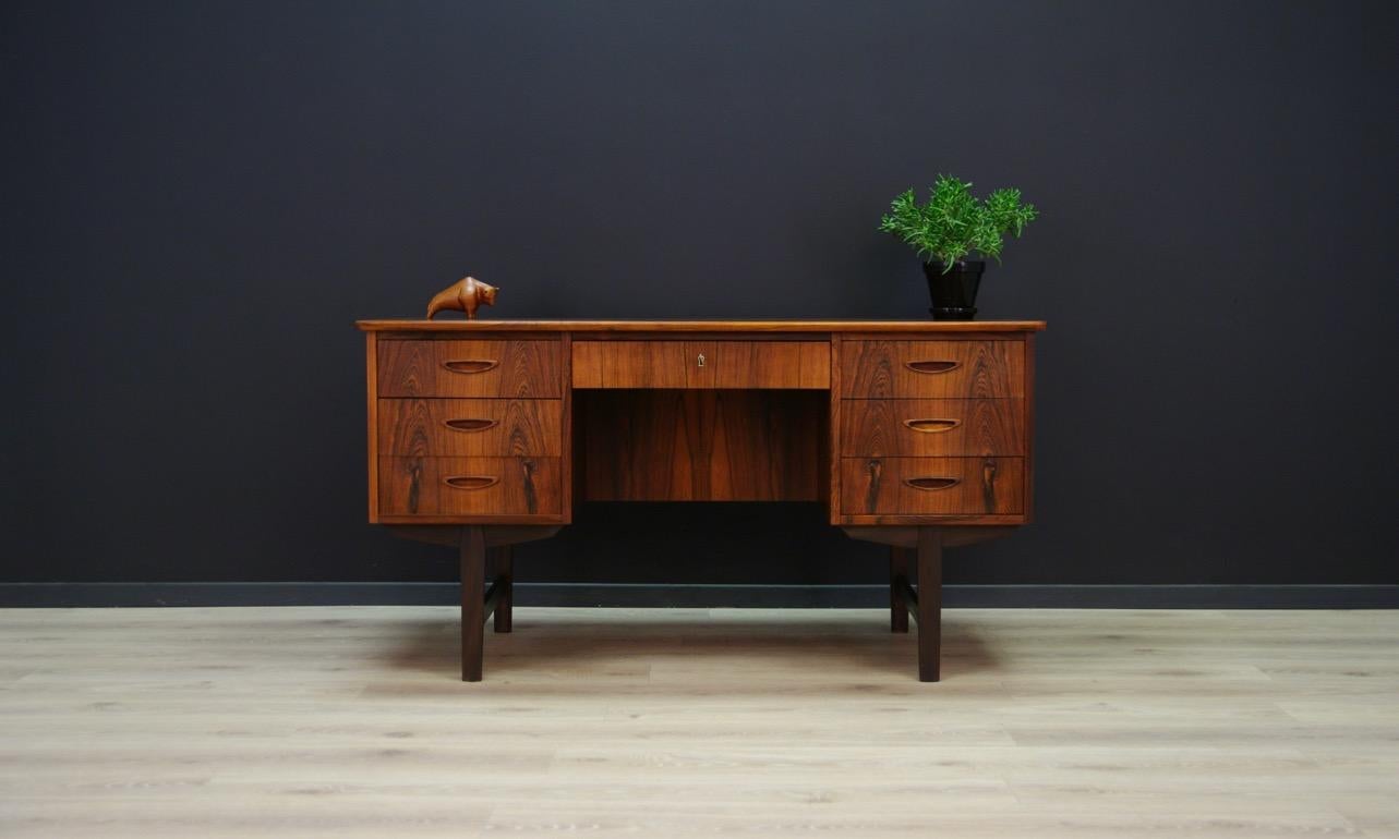 Unique writing desk, Danish design from 1960s-1970s. Form veneered with teak. The furniture has seven drawers, two bookshelves in the back, and a bar, inside which there is a shelf. The key in the set. Preserved in good condition (small bruises and