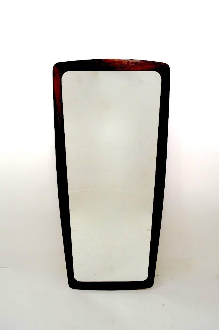 Nice rosewood frame mirror made by Jansen Spejle. Mod oval form, clean, original ready to hang condition, currently configured to hang vertically. Mirror frame approximately 1.75 inches wide.