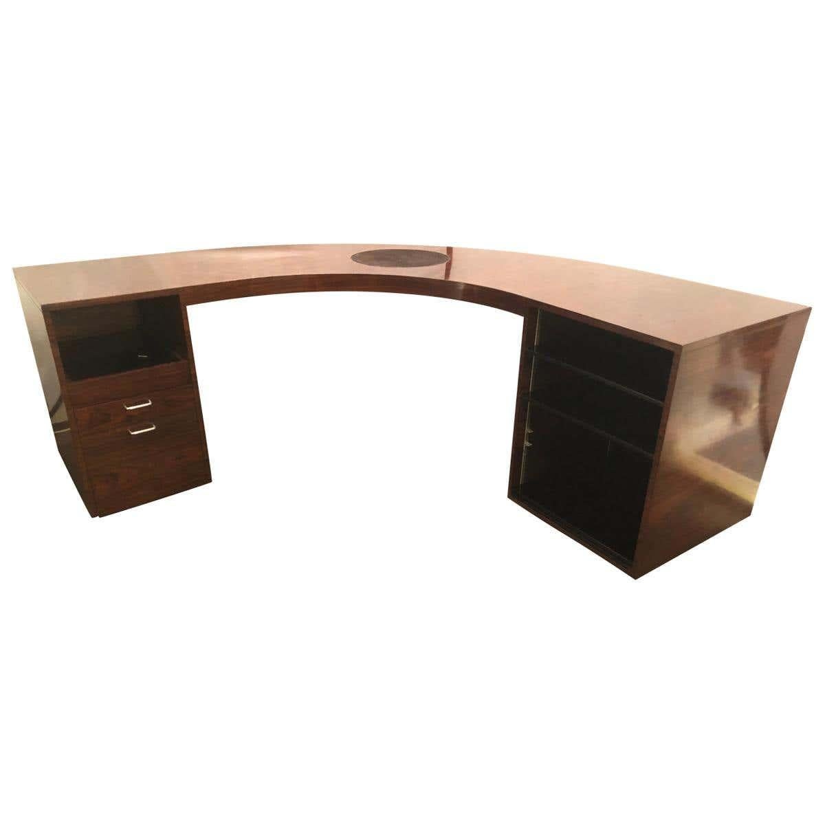 This custom quality rosewood demilune Mid-Century Modern jewelers or large office desk is spectacular. This simply stunning demilune desk is not only palatial in size but stature as well. The fully hand rubbed French polished desk has a large
