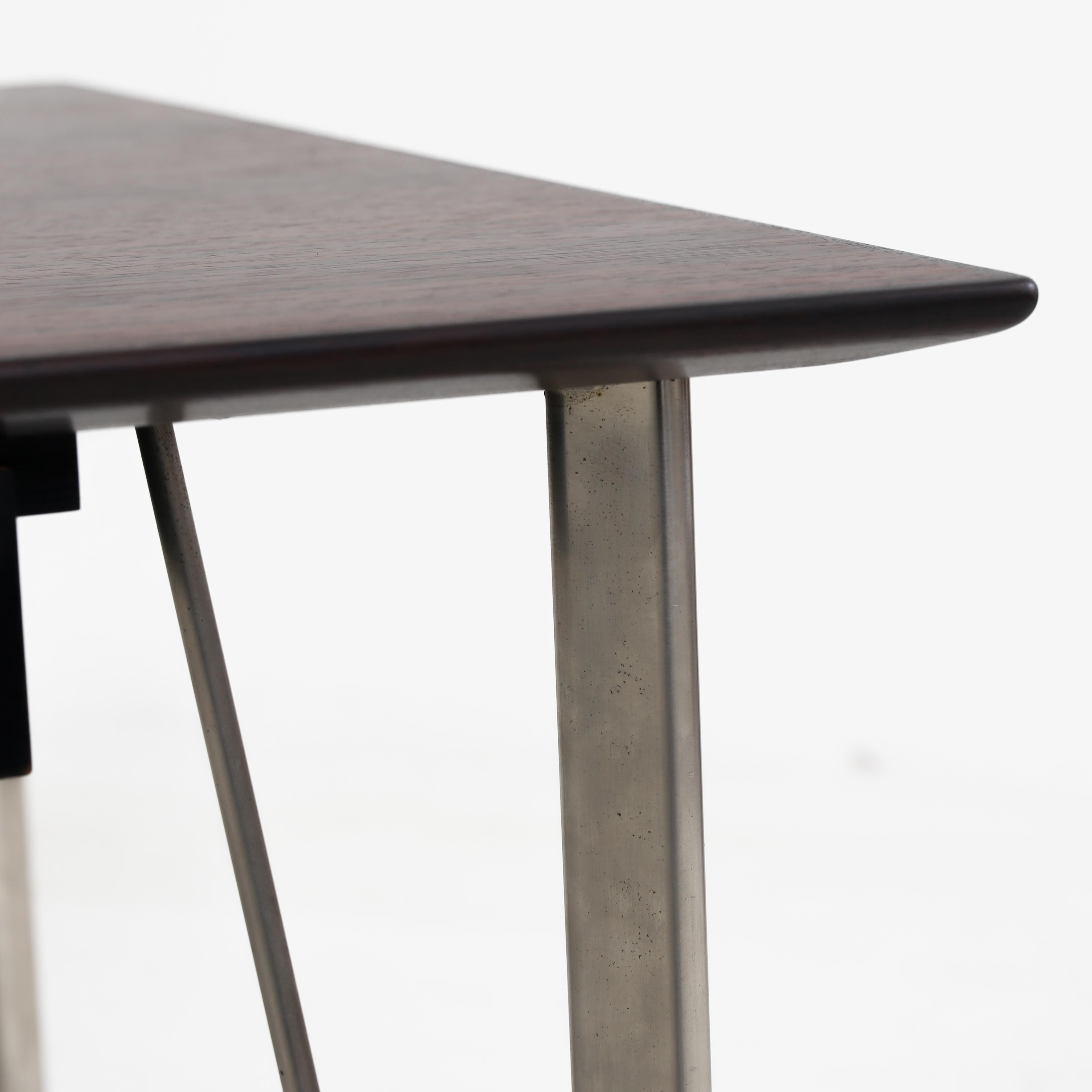 Desk in rosewood with black lacquered drawers, chromed steel legs and solid rosewood shoes. Arne Jacobsen / Fritz Hansen