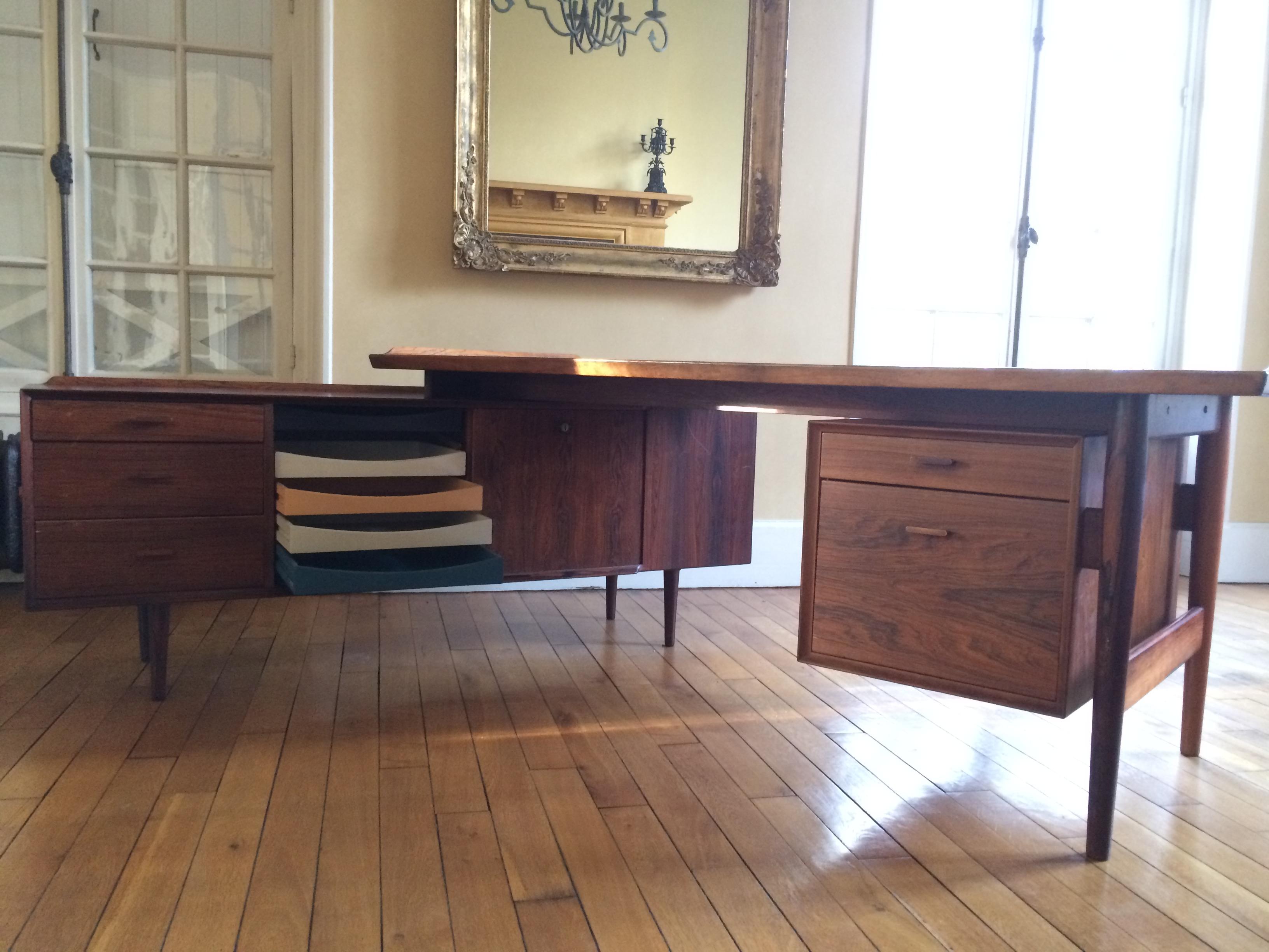 Arne Vodder 1950s desk composed of a sideboard and a tray with exotic wood drawer.
Arne Vodder was a leading light of what might be called the “second generation” of forward-thinking 20th century Danish furniture designers — those who, following in