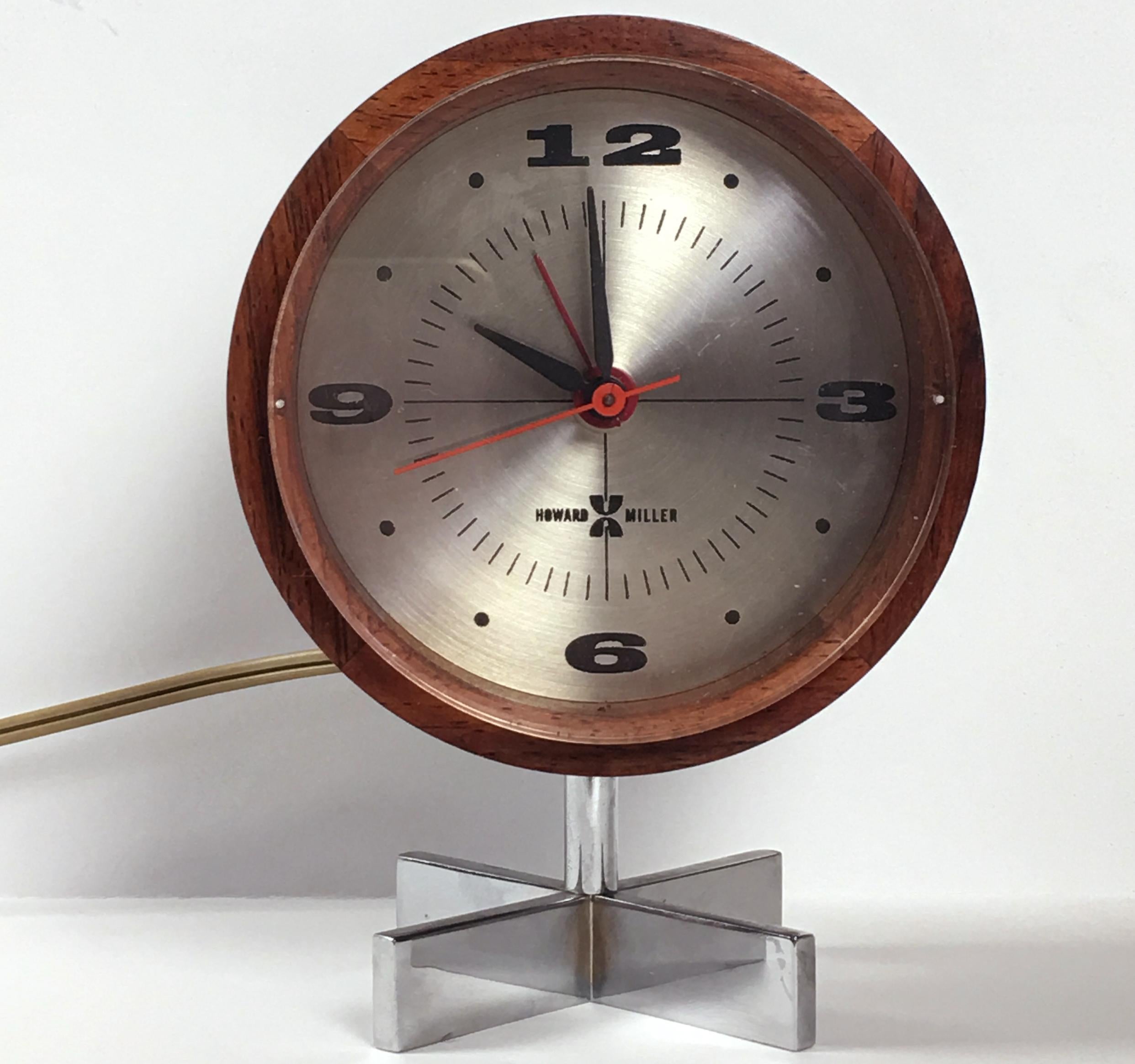 Arthur Umanoff (1923-1985) for George Nelson Associates desk clock
Howard Miller Clock Co., Zeeland, Michigan, 1960s, walnut, steel, Howard Miller label on back  Measures: 4