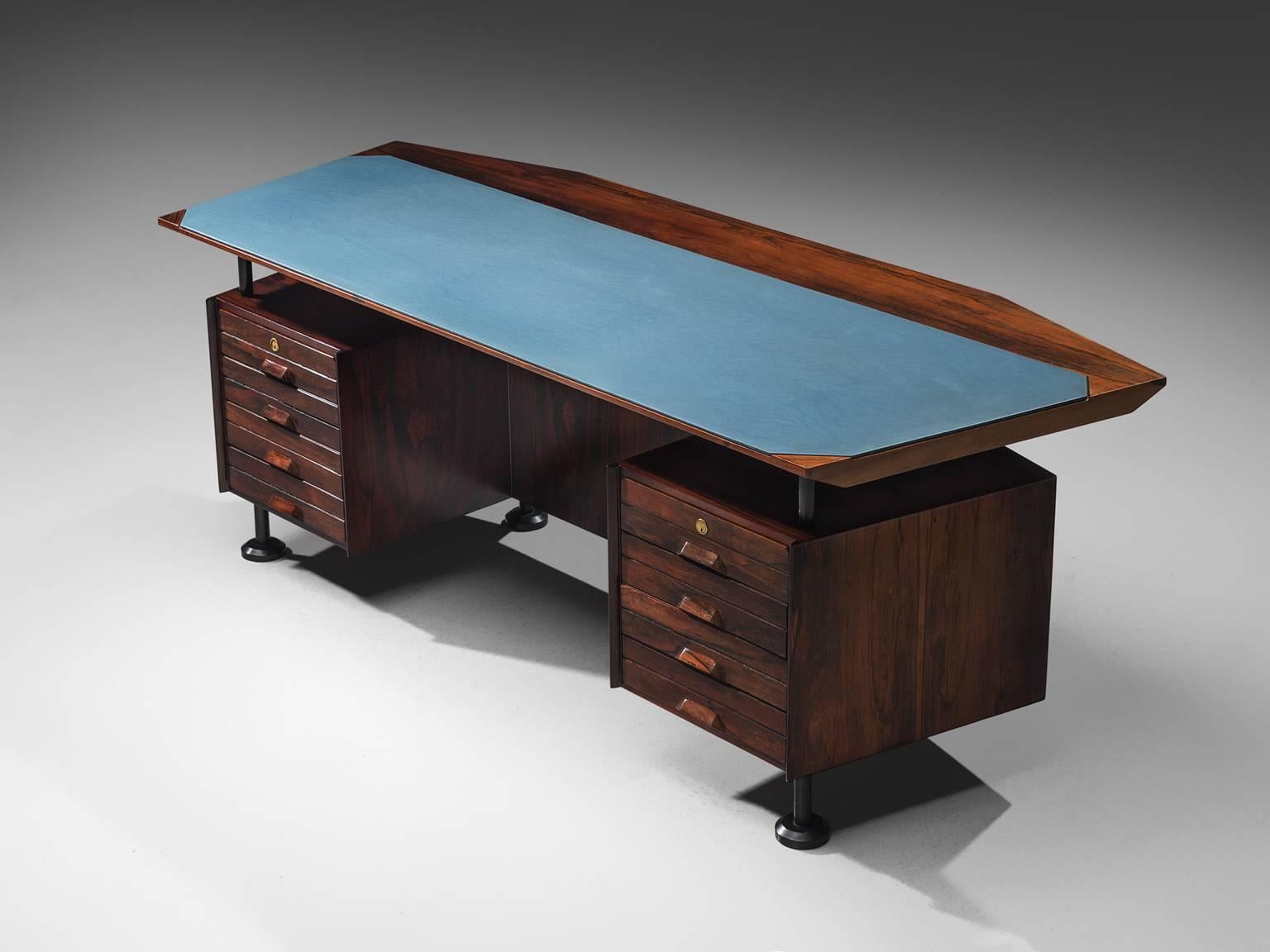 Desk with blue top in rosewood, brass, Italy, circa 1950s.

This table is both refined and distinguished as it's appearance is stately and strong. This sculptural Italian table or writing desk is truly monumental with its dark wood that contrasts