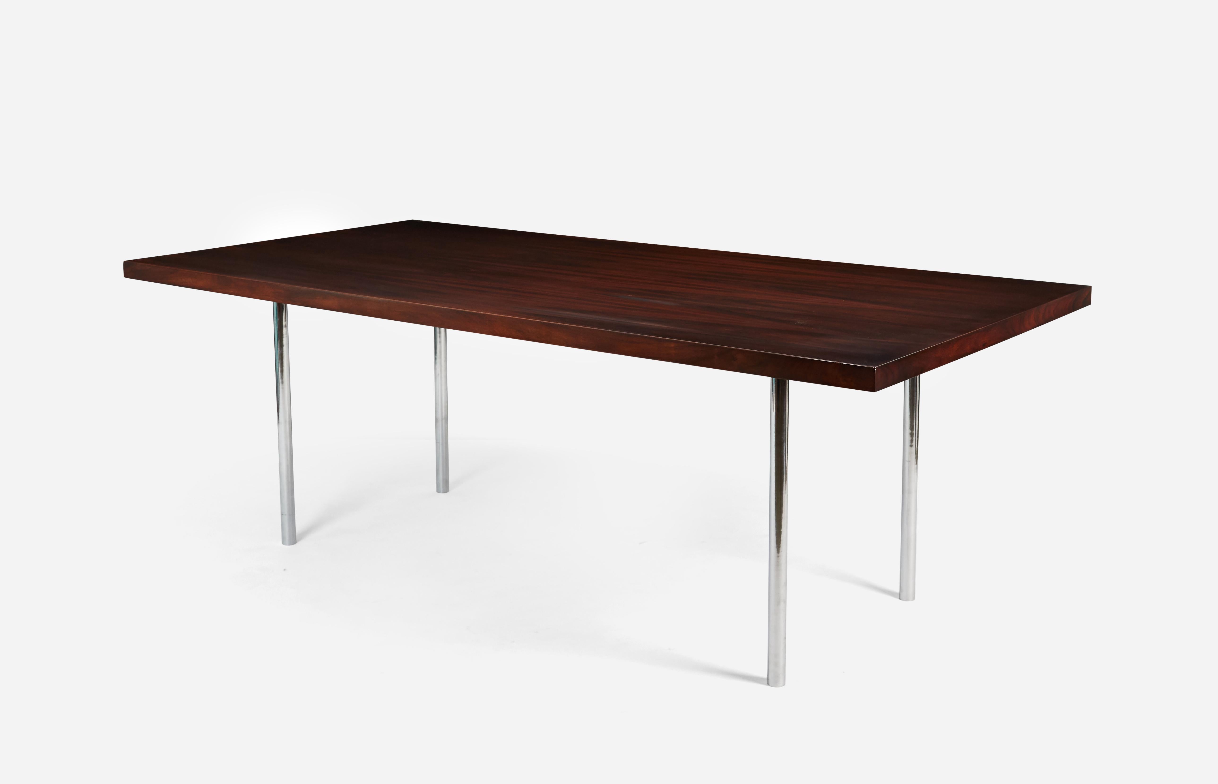 Beautiful rosewood dining table with solid stainless steel legs, circa 1960s. Ludwig Mies van der Rohe had this same model of table in his own apartment in Chicago. Fully restored, refinished.