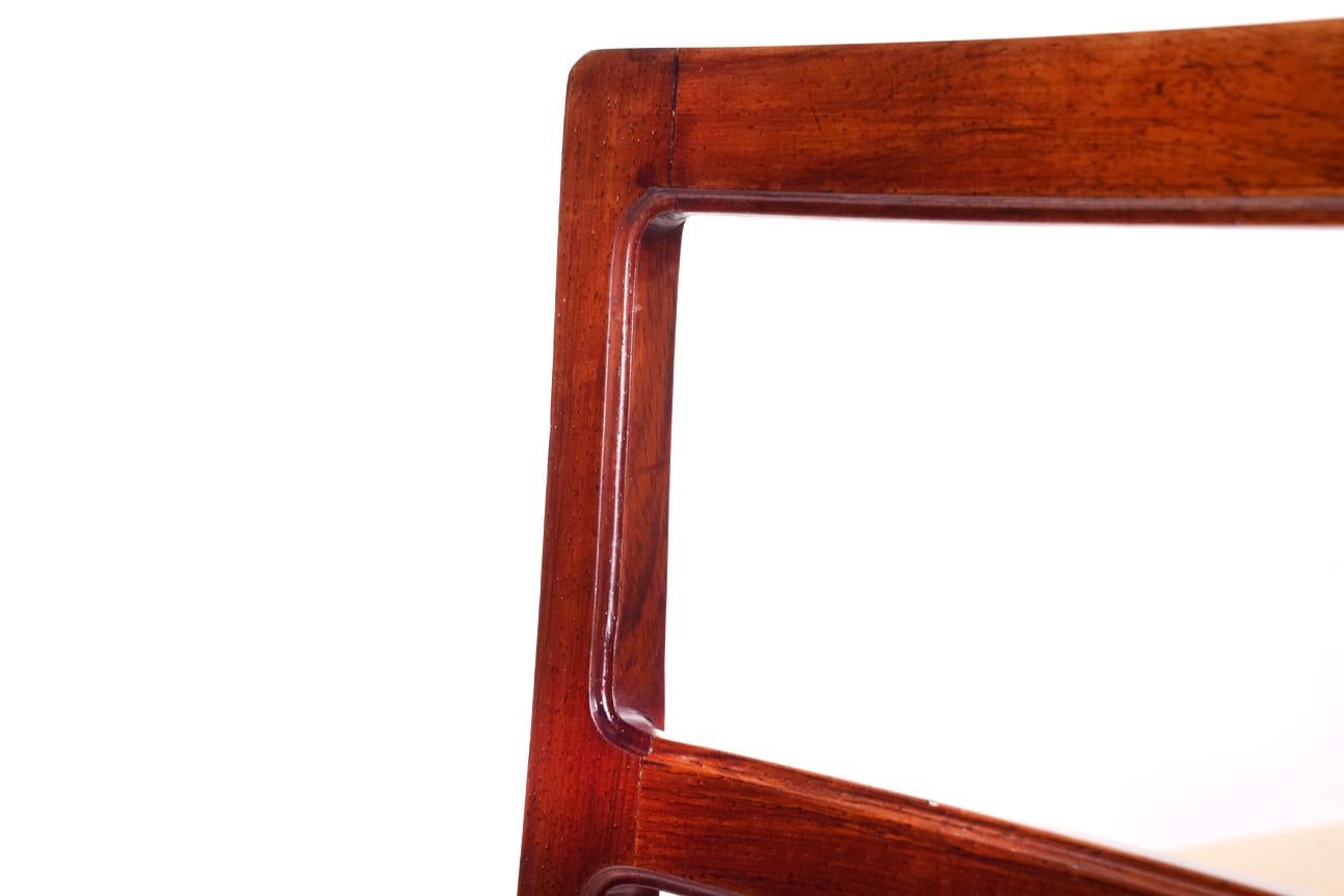 Immerse yourself in the elegance of mid-century design with this stunning set of six dining chairs, a testament to the master craftsmanship of Johannes Andersen, produced by the renowned Bernhard Pedersen & Sons in 1965. Each chair in this