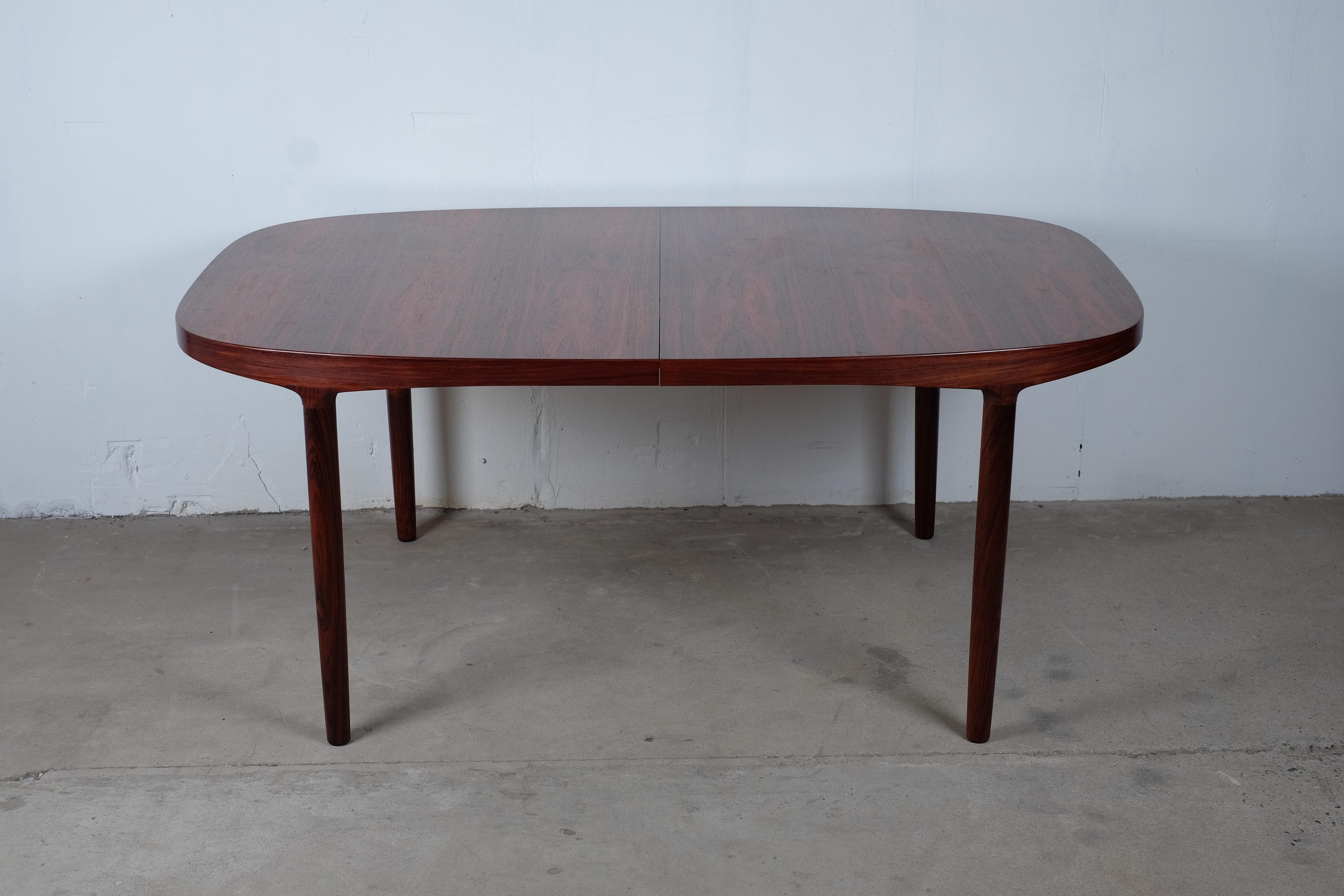 Rosewood dining table by Danish designer Harry Østergaard for Randers Møbelfabrik.

Very beautiful table with Two extra leaves, both are 55 cm in width so the table can be extended to 280 cm in total with both leaves in.

The condition of the