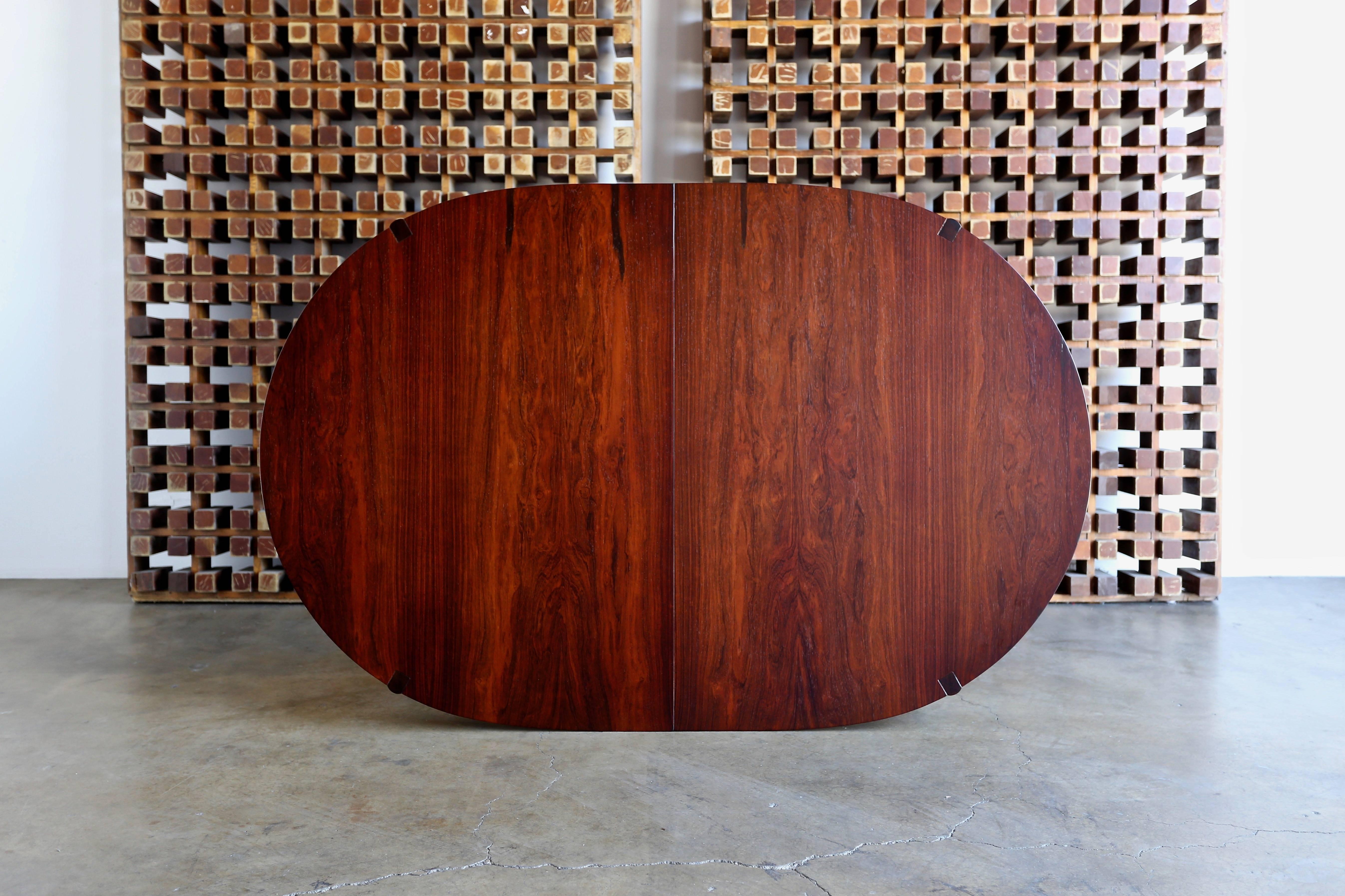Rosewood dining table by Greta Grossman for Glenn of California. 

This table has two leaves that each measure 19.75