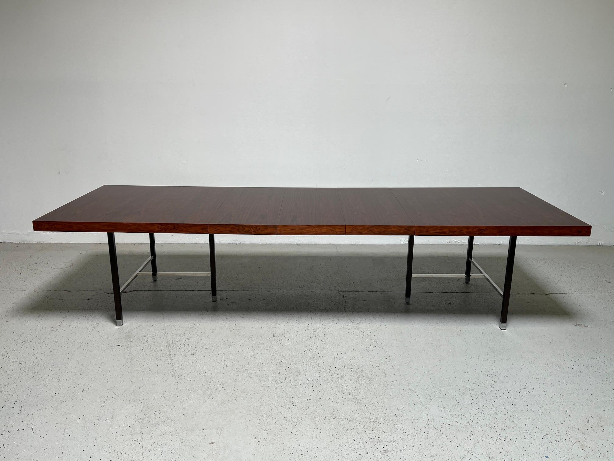 Harvey Probber dining table with rosewood top, mahogany legs and chrome stretchers. Measurements include three 16
