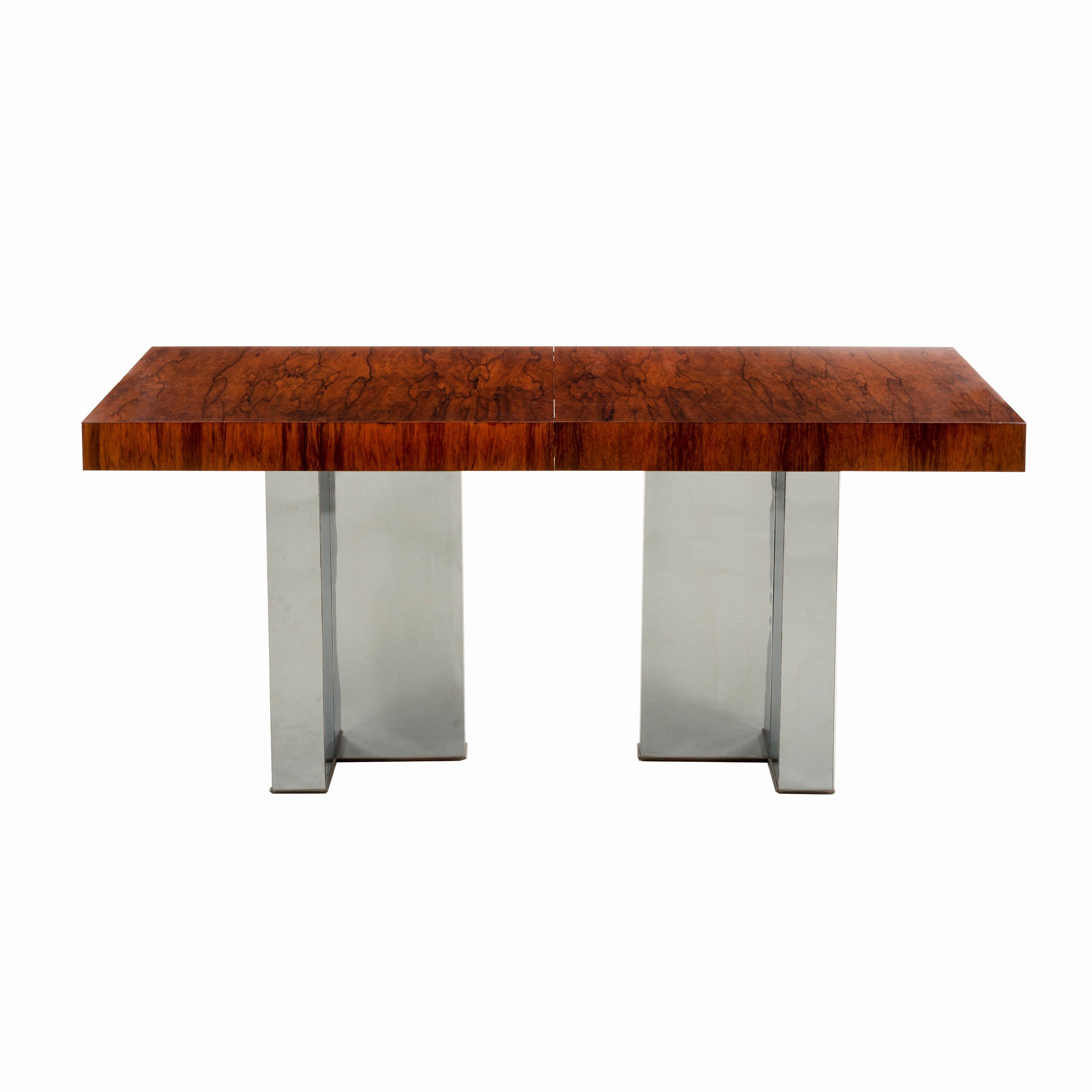 Milo Baughman for Thayer Coggin; exotic bookmatched cathedral patterned rosewood top with T- patterned chrome legs. Two leaves the table extends to 98