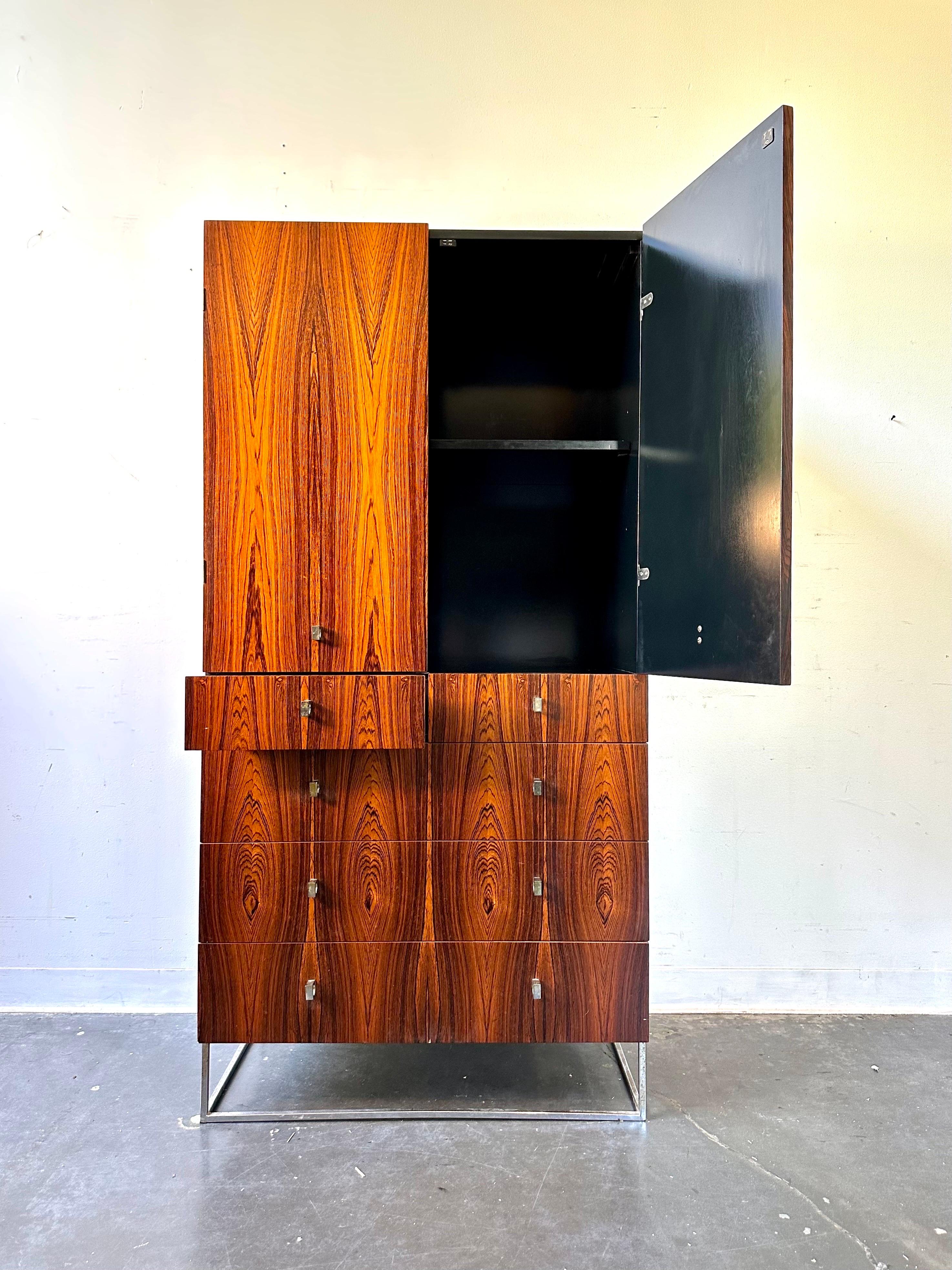 Rosewood dresser armoire by Roger Rougier

Gorgeous rosewood and black lacquer armoire with chrome base.

Great vintage condition with minor signs of wear.

Dimensions:
64” x 20” x 32”.