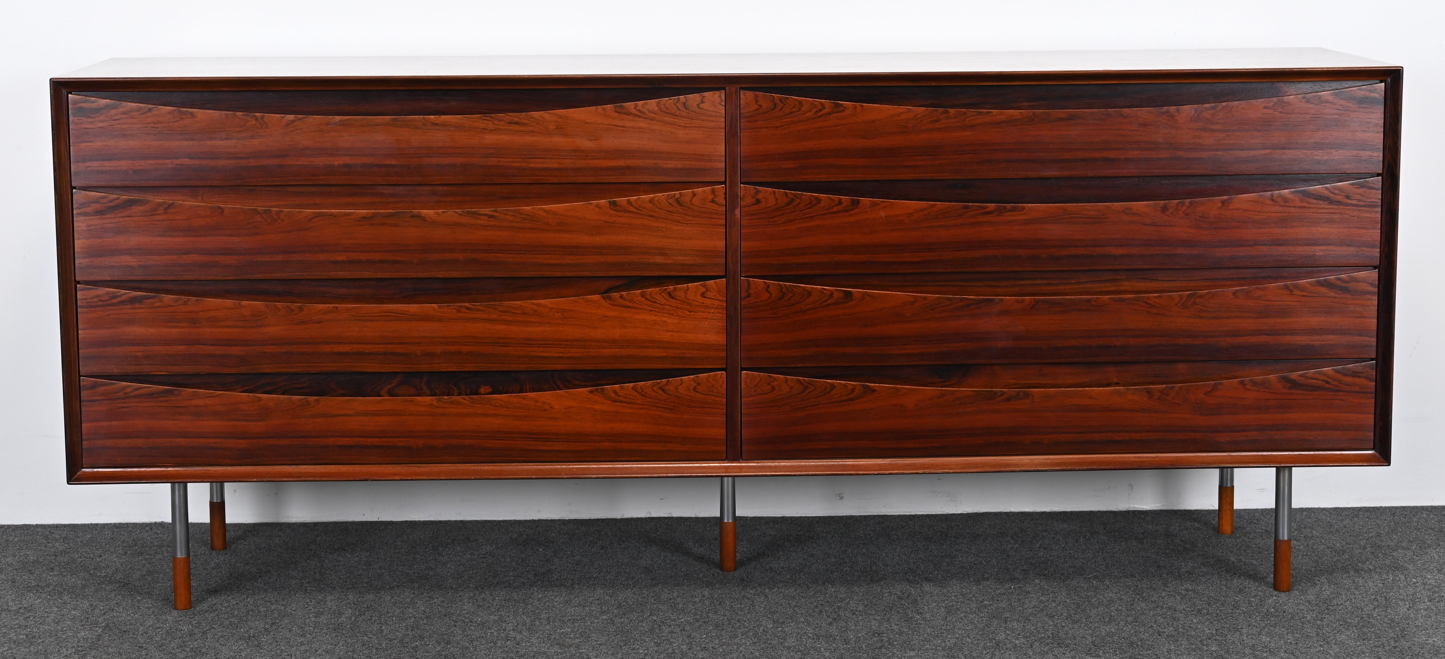 A gorgeous rosewood Dresser by Arne Vodder for Sibast, 1960s. This Scandinavian Modern cabinet seems to be rare as it has metal legs instead of wood and there are not many on the marketplace. The Danish rosewood chest would look great in any