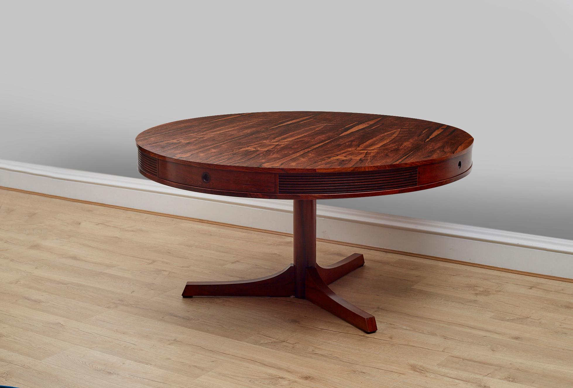 A Superb Rosewood drum dining table designed by Robert Heritage for Archie Shine, called ‘The Bridgford’ dining table. Made in England in the 1960's. 

One of the best examples we’ve seen with a truly stunning veneer pattern and deep Rosewood