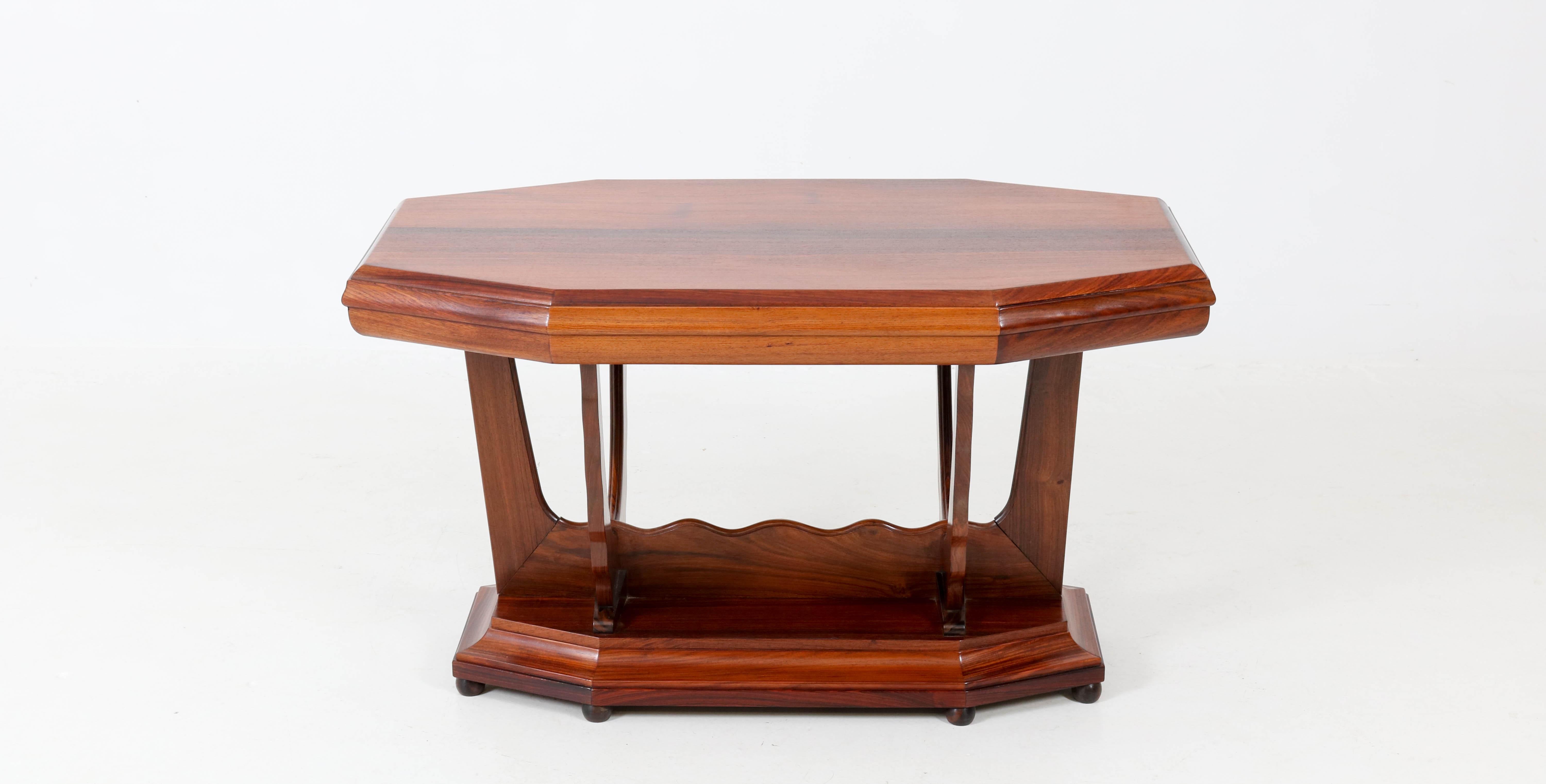 Stunning and rare Art Deco Amsterdam School side table.
Attributed to Max Coini Amsterdam.
Striking Dutch design in solid rosewood from the 1920s.
In good original condition with minor wear consistent with age and use,
preserving a beautiful