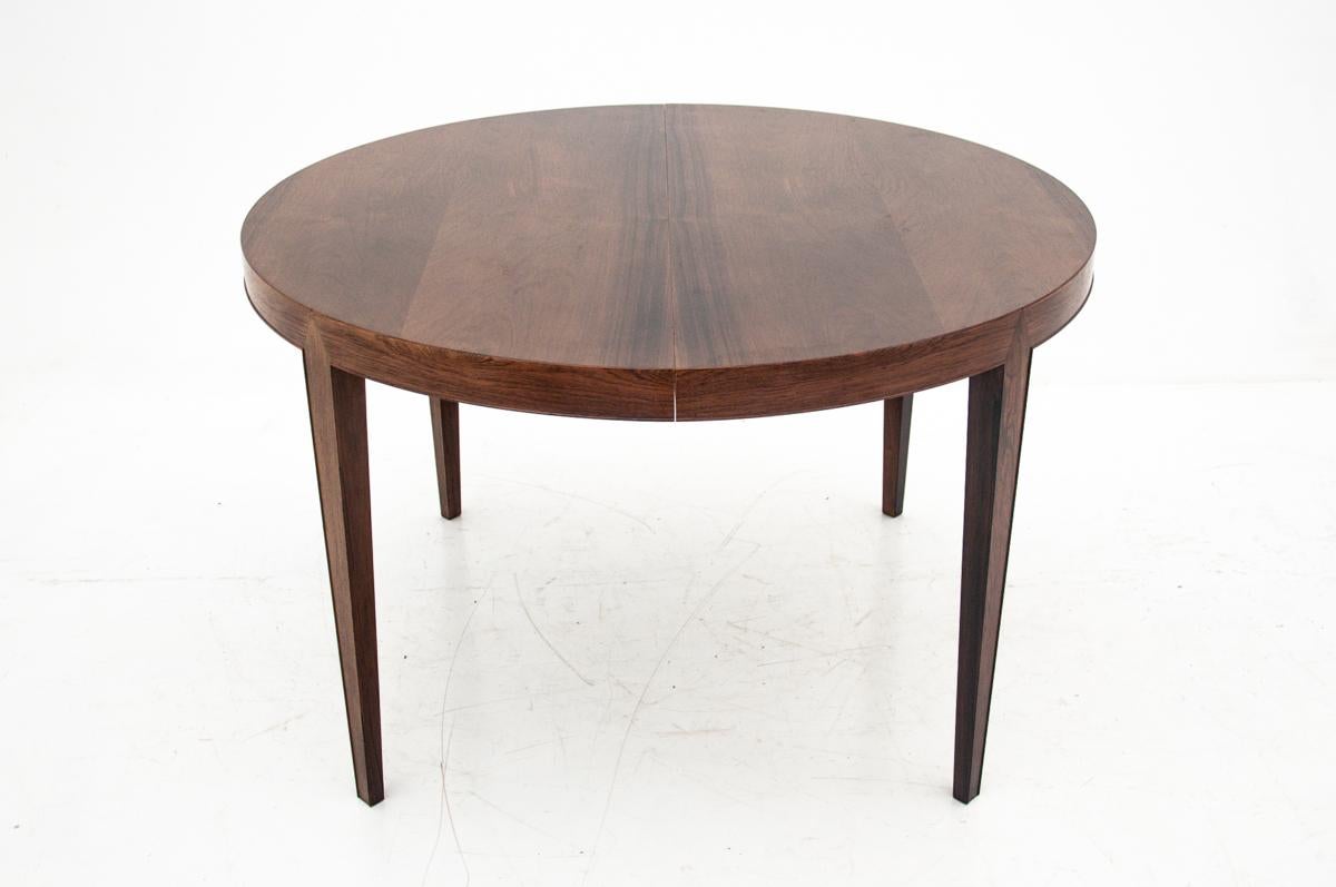 Rosewood round table comes from Denmark in the 1960s. Designed by Severin Hansen. In excellent condition, after the wood renovation process. It has two additional inserts that allow it to unfold up to 217 cm.