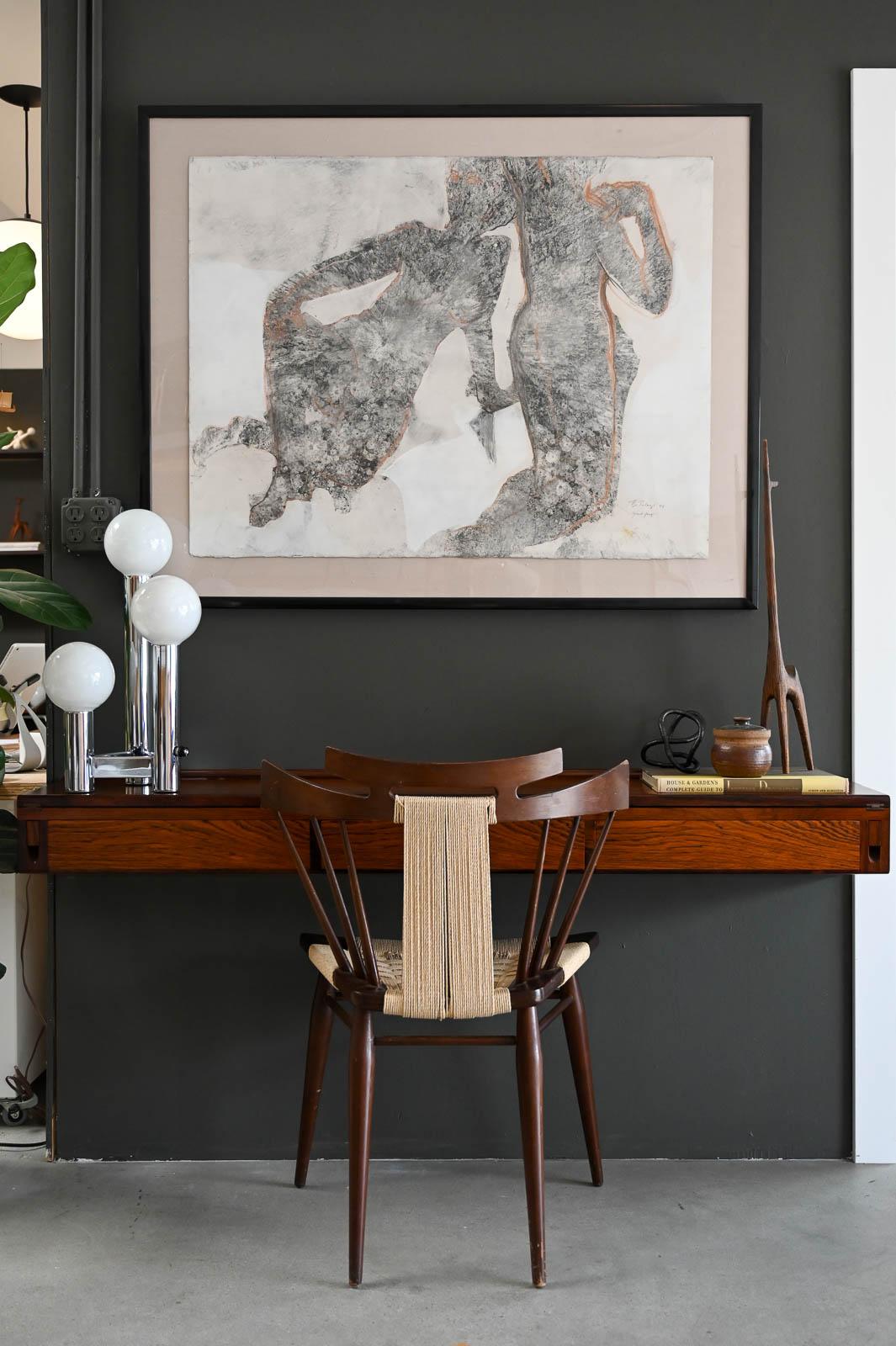 Rosewood Floating Desk by Arne Hovmand-Olsen, ca. 1960.  Stunning and rare floating rosewood desk with exceptional craftsmanship by Arne Hovmand-Olsen.  This floating desk can be mounted on any wall (hardware not included), predrilled holes in the