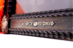Rosewood frame with silver floral appliqués and shading