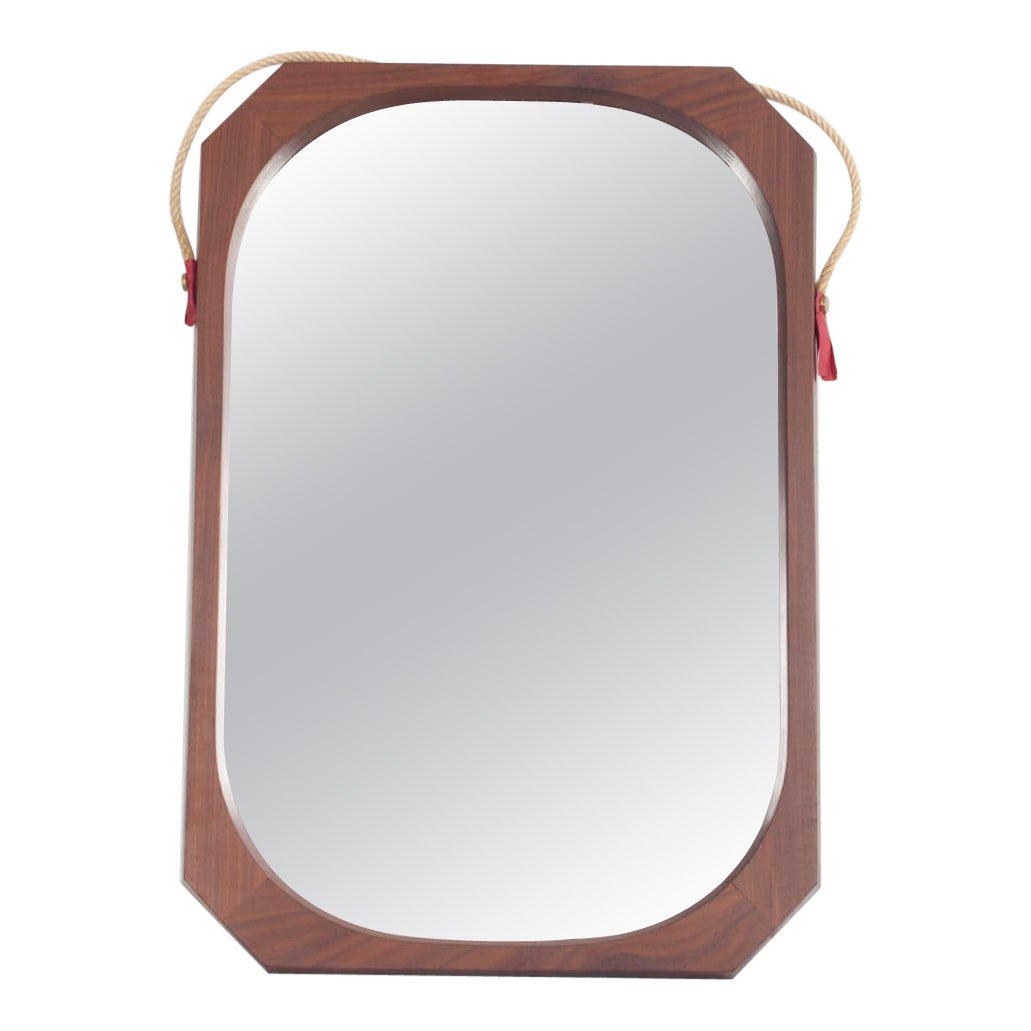 Miroir italien encadré de bois de rose des années 60.