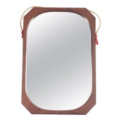 Miroir italien encadré de bois de rose des années 60.