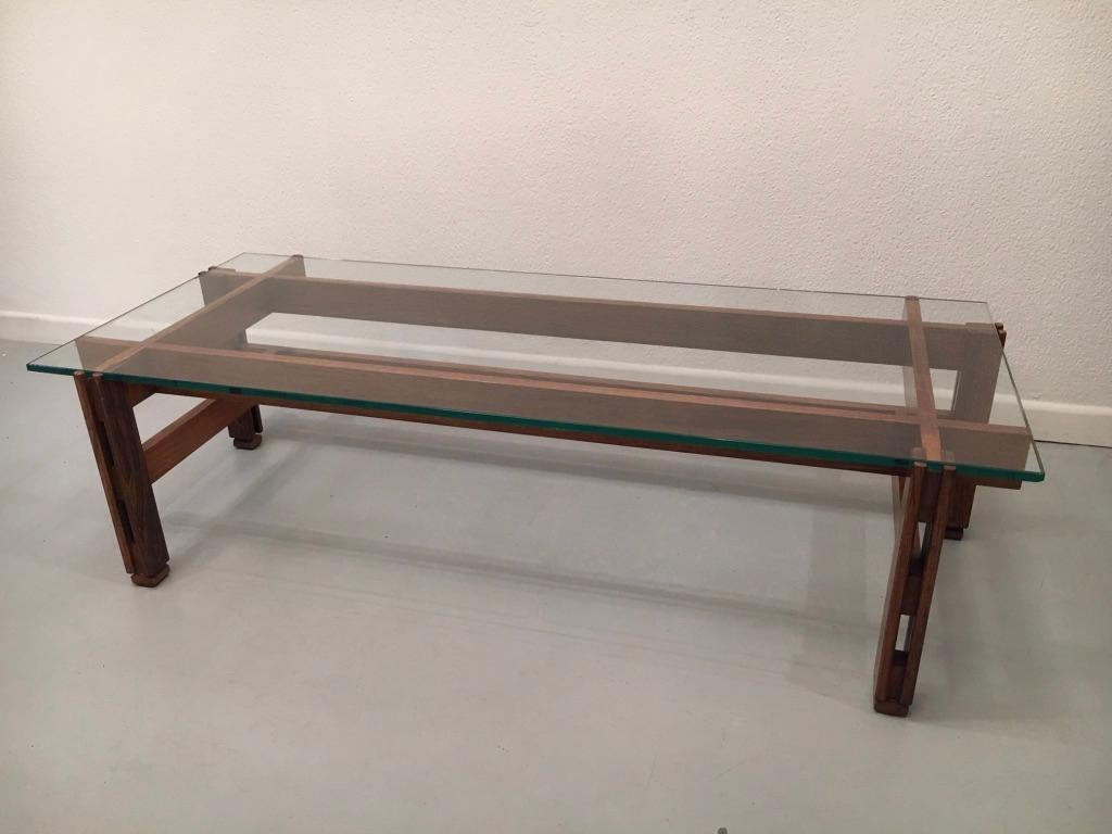 Asymetrical rosewood and glass coffee table model 751 by Ico Parisi produced by Cassina ca. 1960s
Few stripes and one chip on the glass top, can be easily replaced.
Measures: L 132 x l 57 x H 35 cm.
