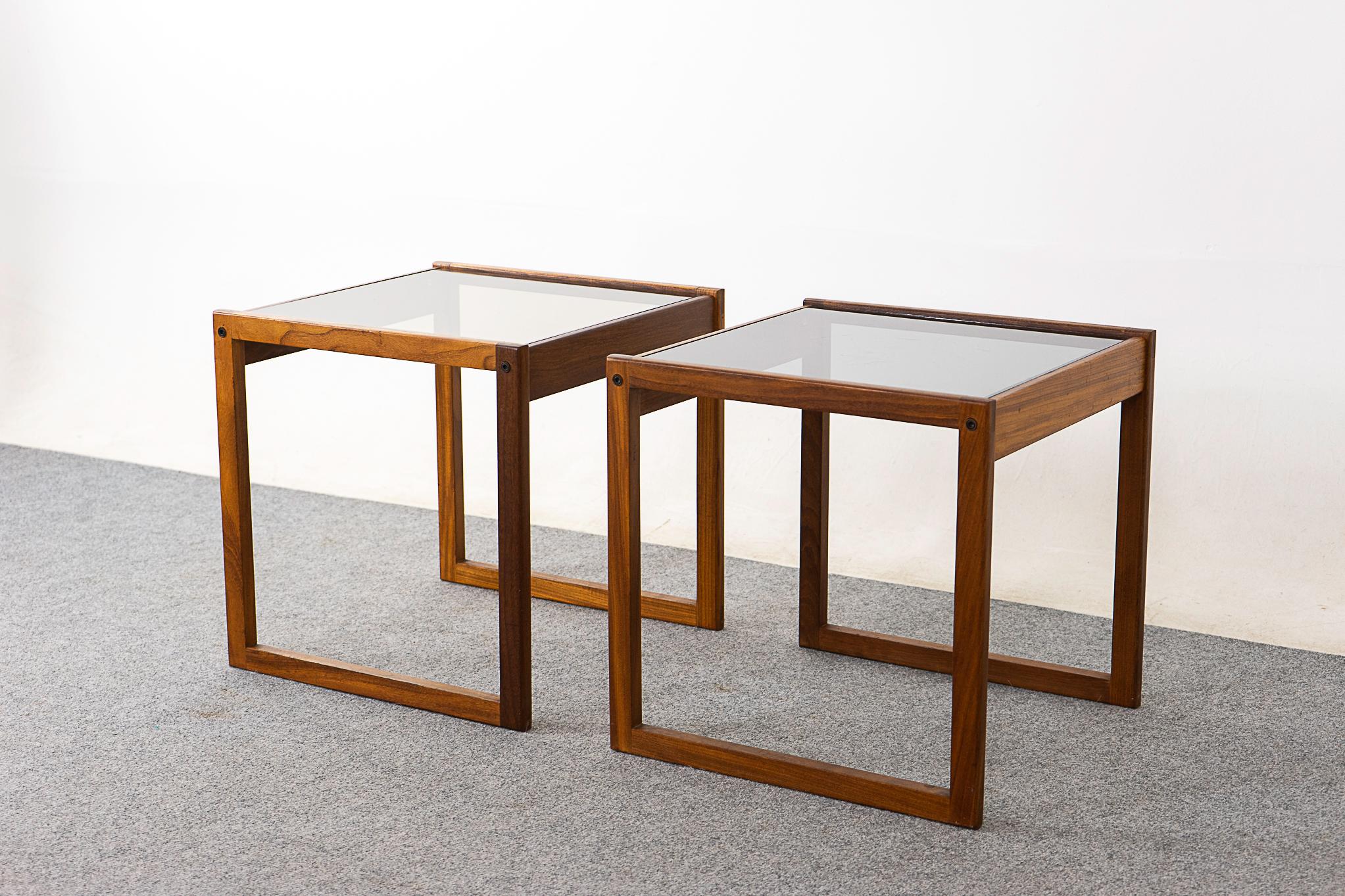 Rosewood & glass mid-century side tables , circa 1960's. Lovely delicate frames with original smoke glass. 

Please inquire for remote and international shipping.

