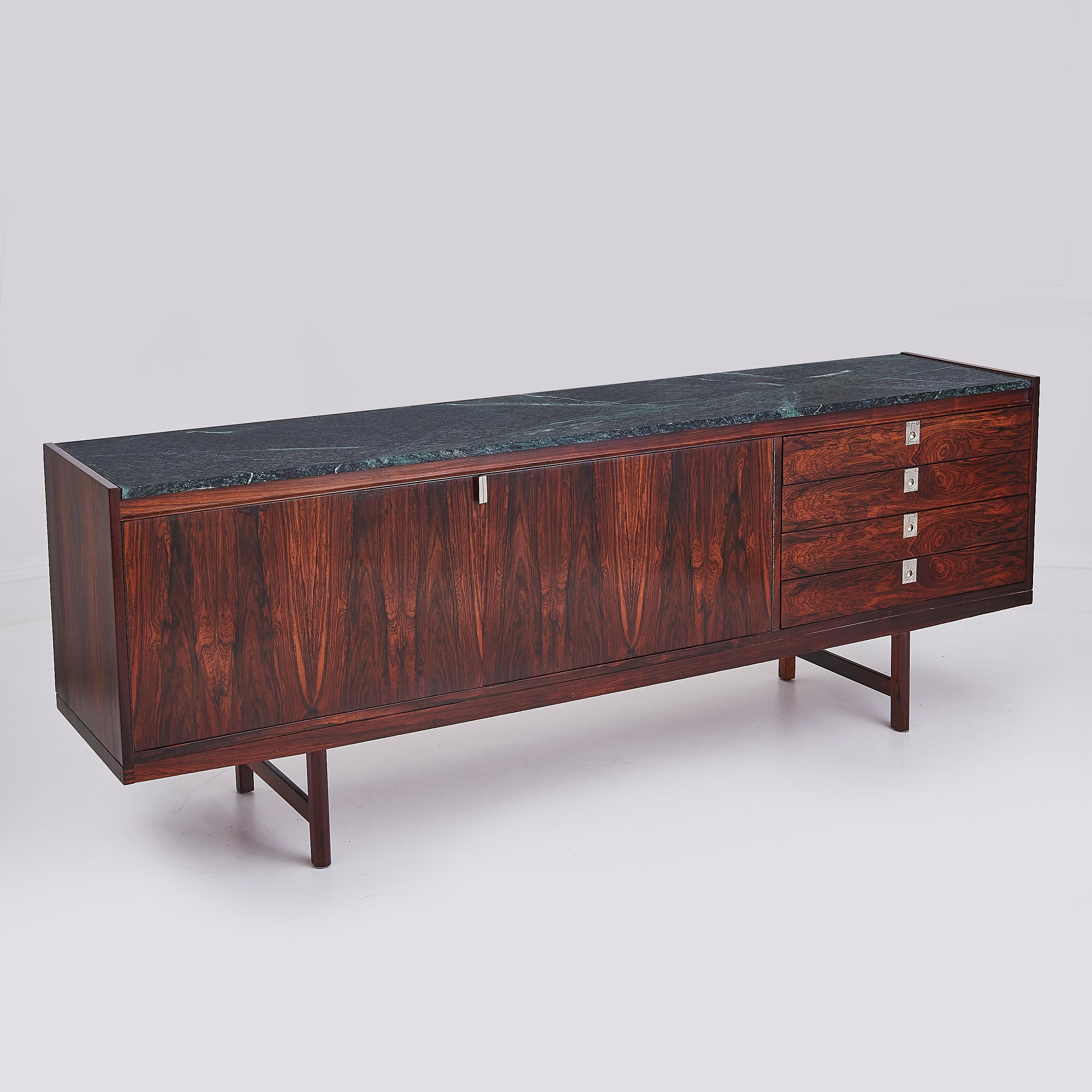 A masterpiece of mid 20th century British design, this exquisite Rosewood sideboard by Robert Heritage for Archie Shine is a true testament to the designer’s refined aesthetic and commitment to craftsmanship. Defined by its sleek, architectural