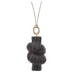 Pendentif « nœud d'amour » en bois de rose sculpté à la main
