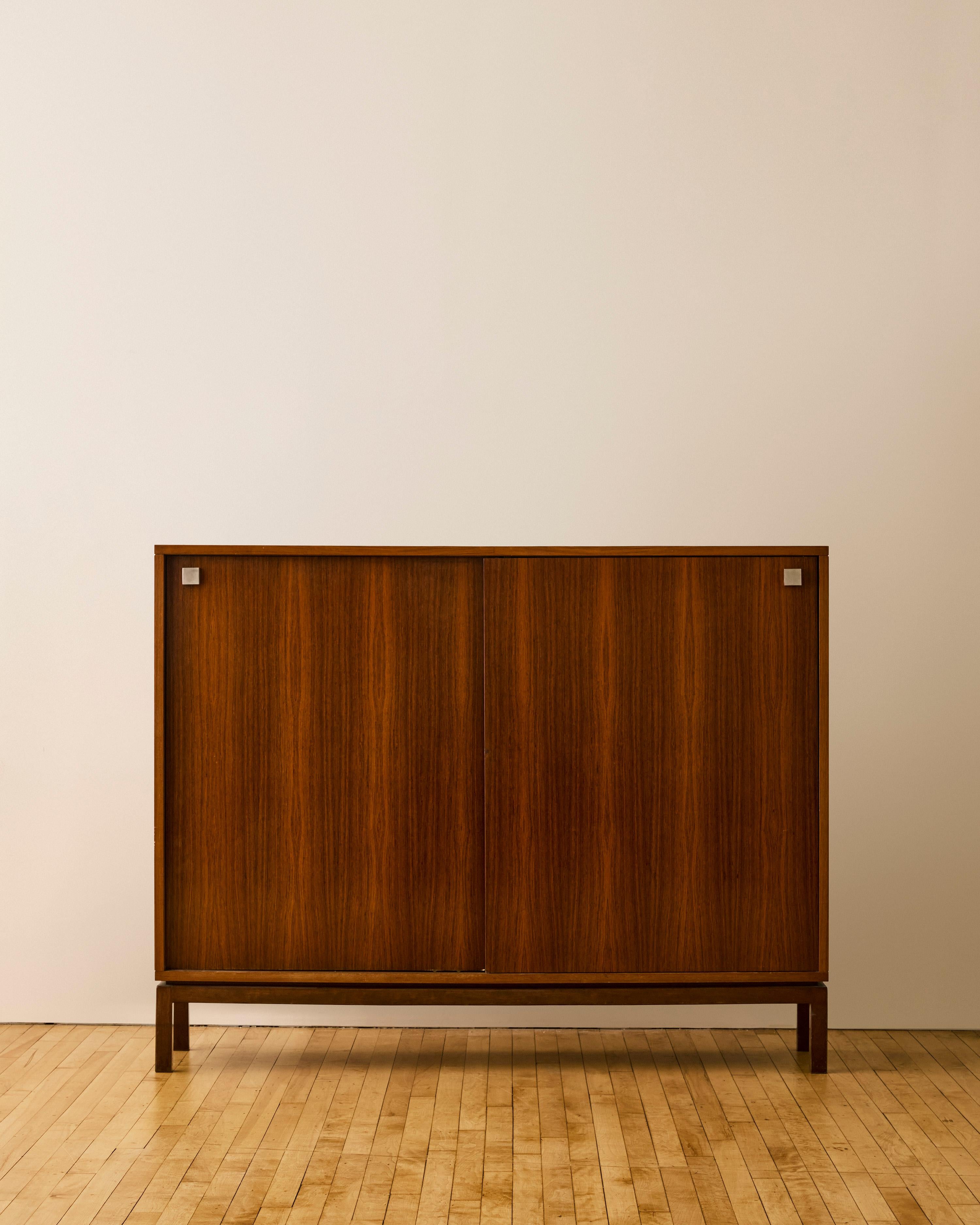 Rosewood highboard cabinet by Alfred Hendrickx for Belform featuring chrome square detailing and sliding door with drawers and shelving.