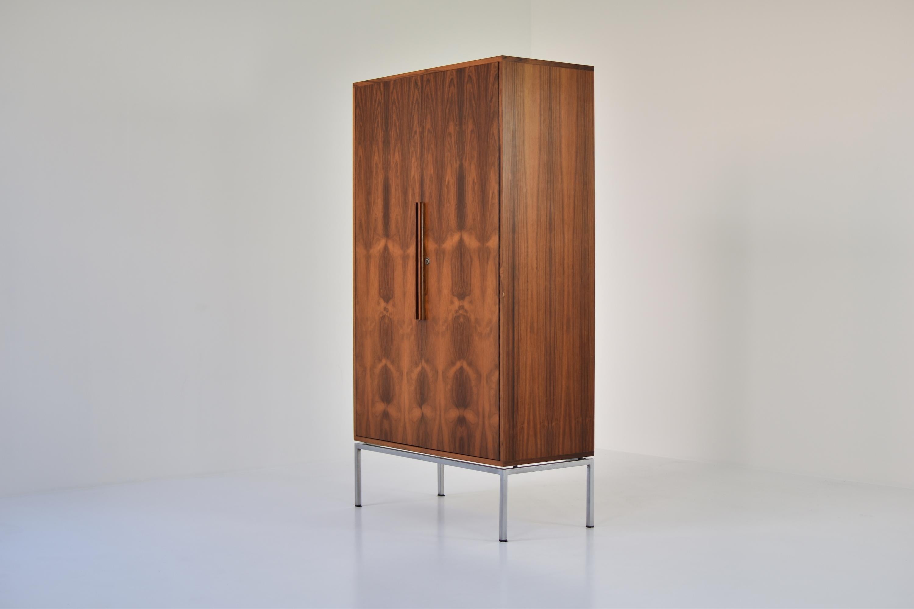 Impressive rosewood highboard from the 1960s. This cabinet features 2 doors revealing plenty of storage area. Very nice grain on the rosewood. Designer unknown.