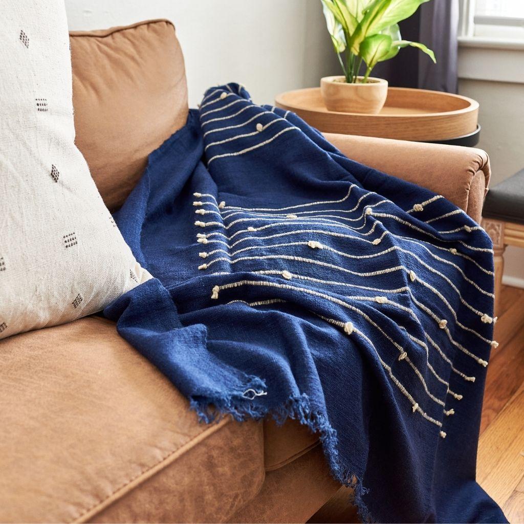 Custom design by Studio Variously, ROSEWOOD INDIGO merino throw / blanket is hand-woven by master weavers in Nepal and dyed entirely with eco-friendly dyes. 

A sustainable design brand based out of Michigan, Studio Variously exclusively