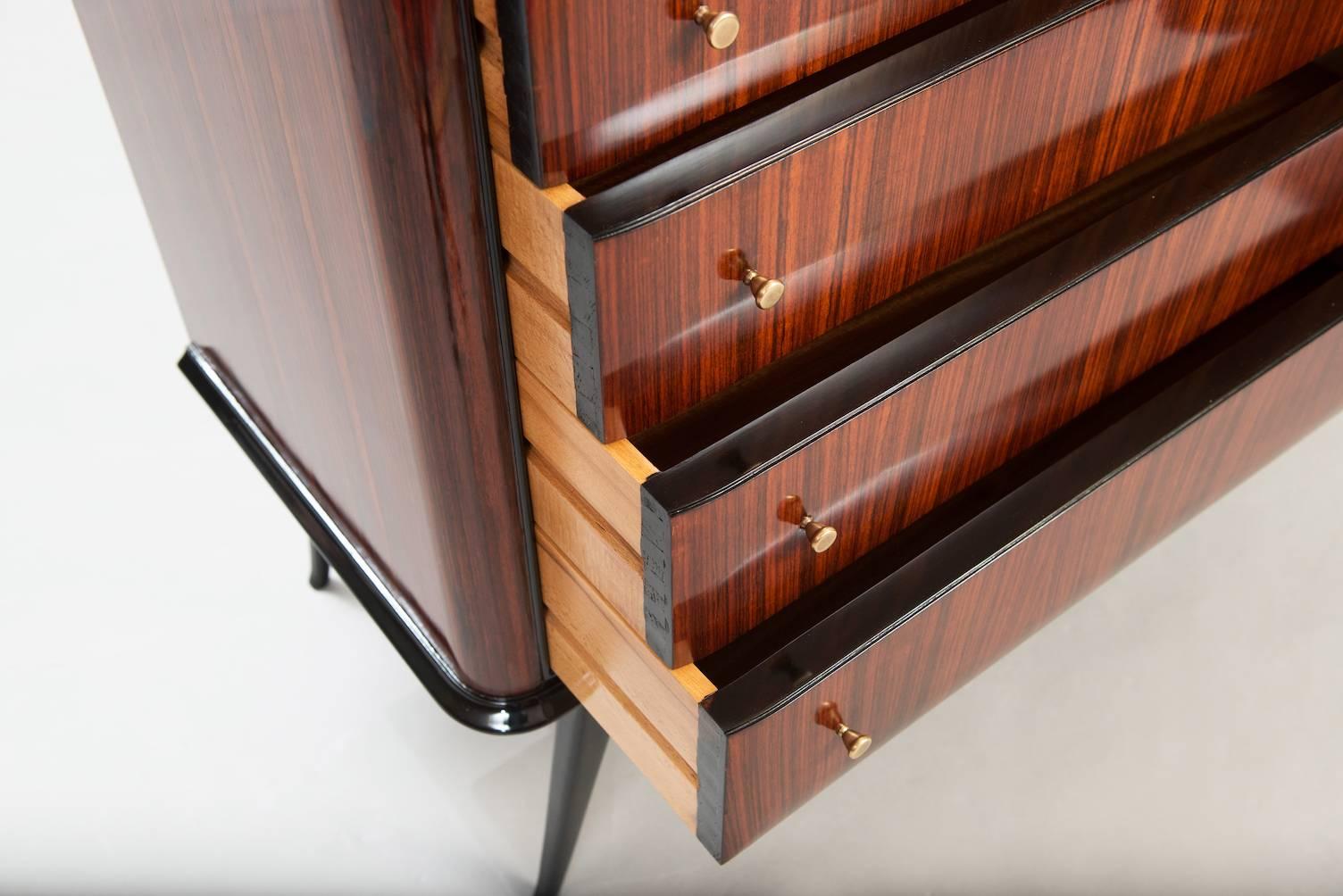 Rosewood chest of drawers, brass door handles.